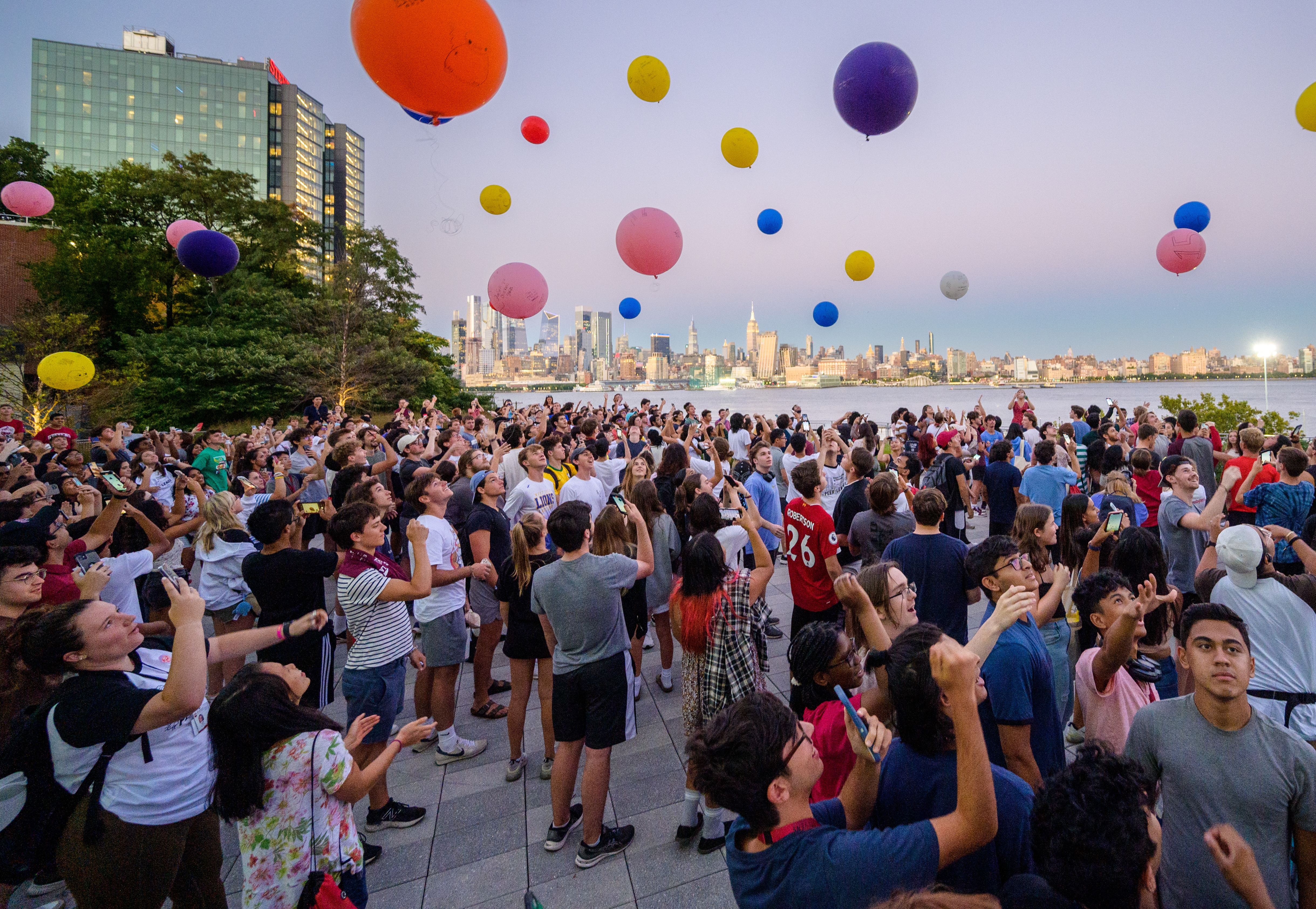 Stevens students on the Babbio patio launching balloons