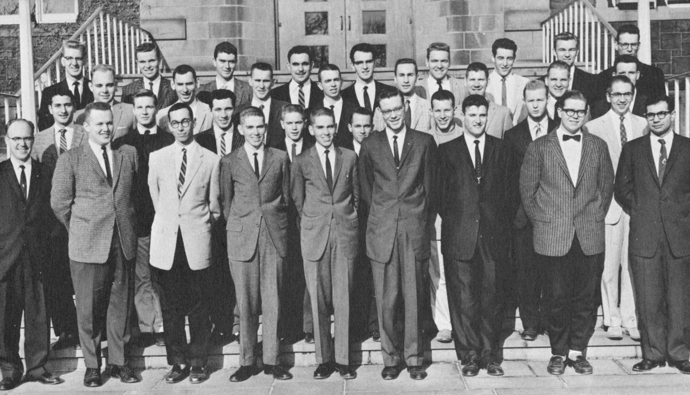 Black and white photo of The Stute staff, about 35 men in suits
