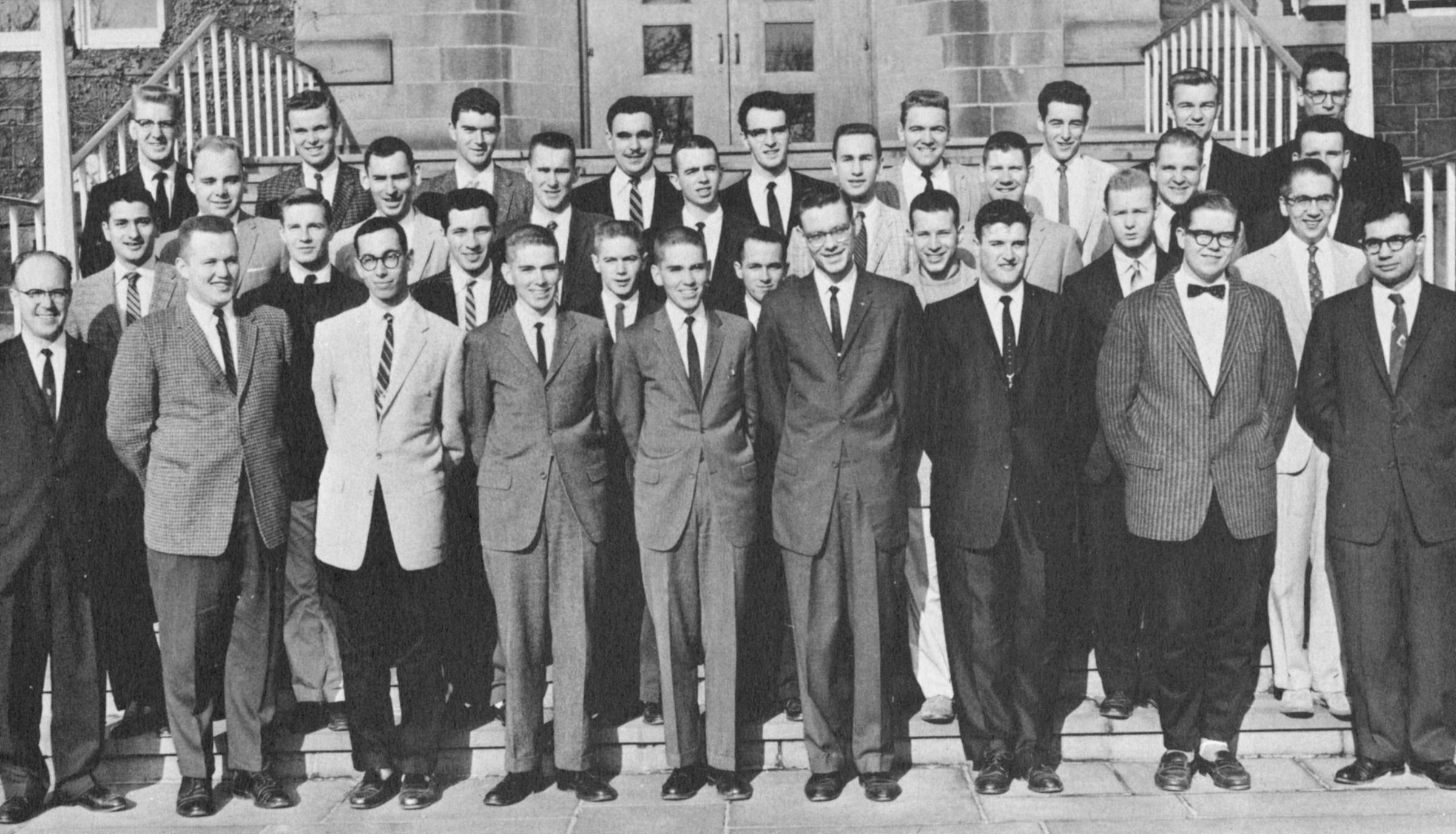 Black and white photo of The Stute staff, about 35 men in suits