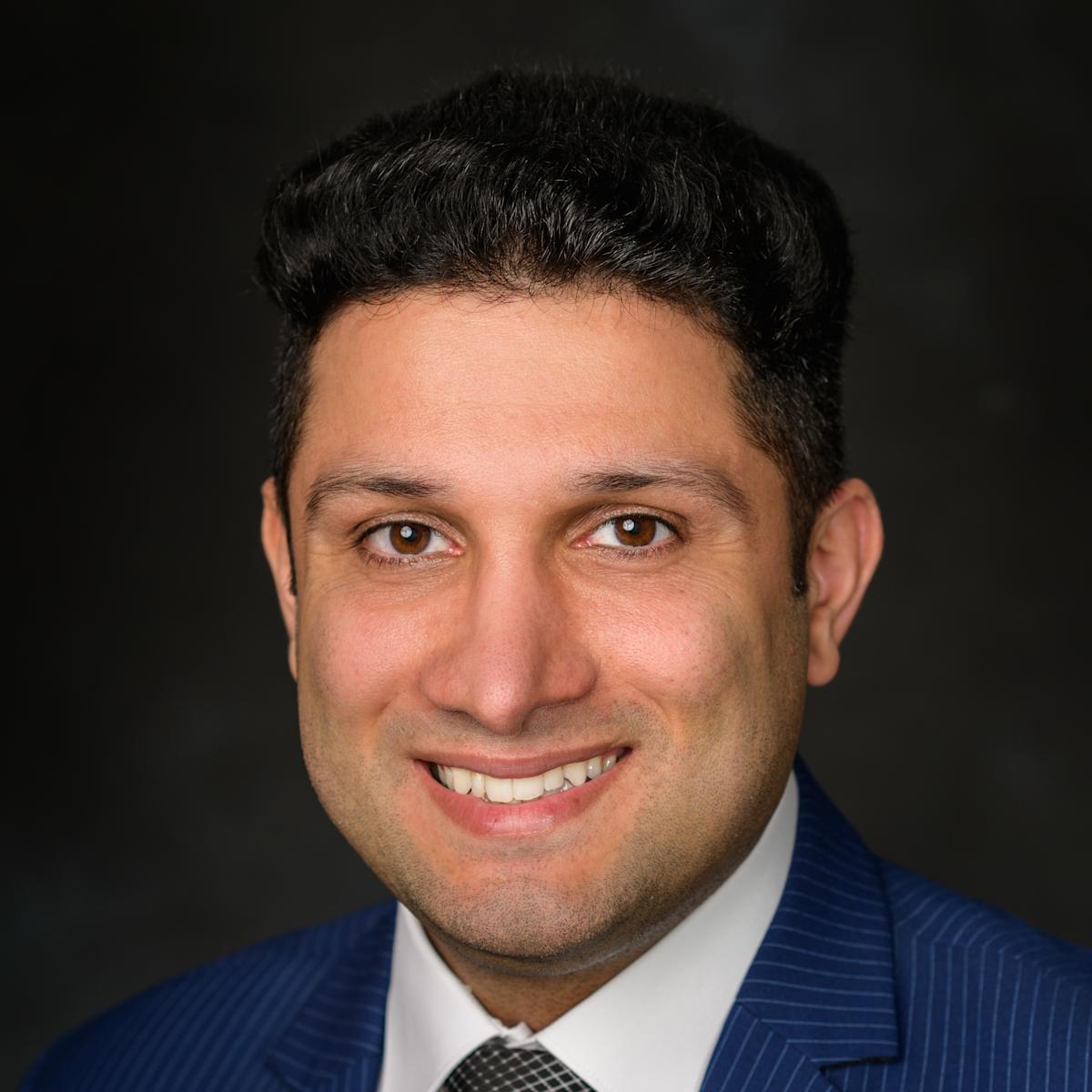 A headshot of Hadi Safari Katesar 