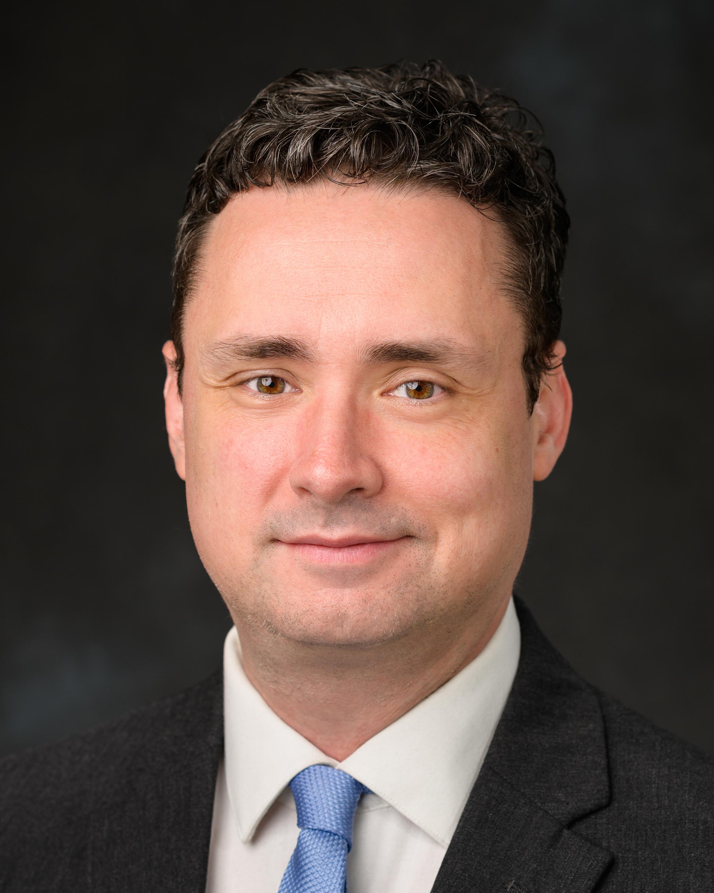 A headshot of Christopher Robinson, our Senior Director of Multimedia