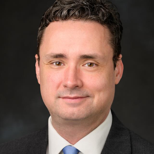 A headshot of Christopher Robinson, our Senior Director of Multimedia