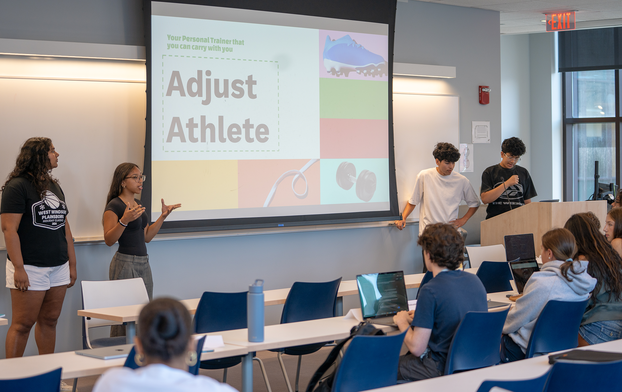A group of pre-college students in the Business & AI program present the AI app they created. 