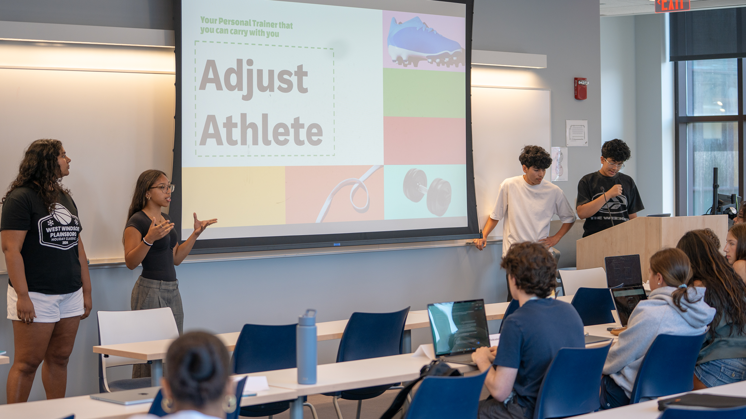A group of pre-college students in the Business & AI program present the AI app they created.