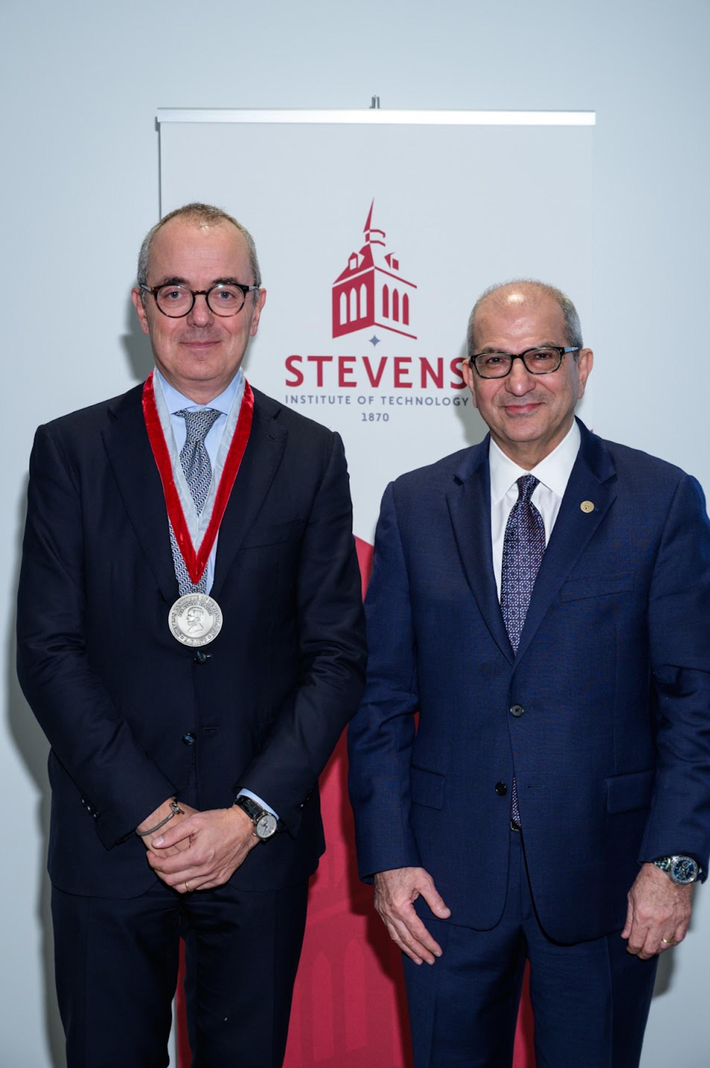 Giovanni Caforio receives a medal from Stevens President Nariman Farvardin