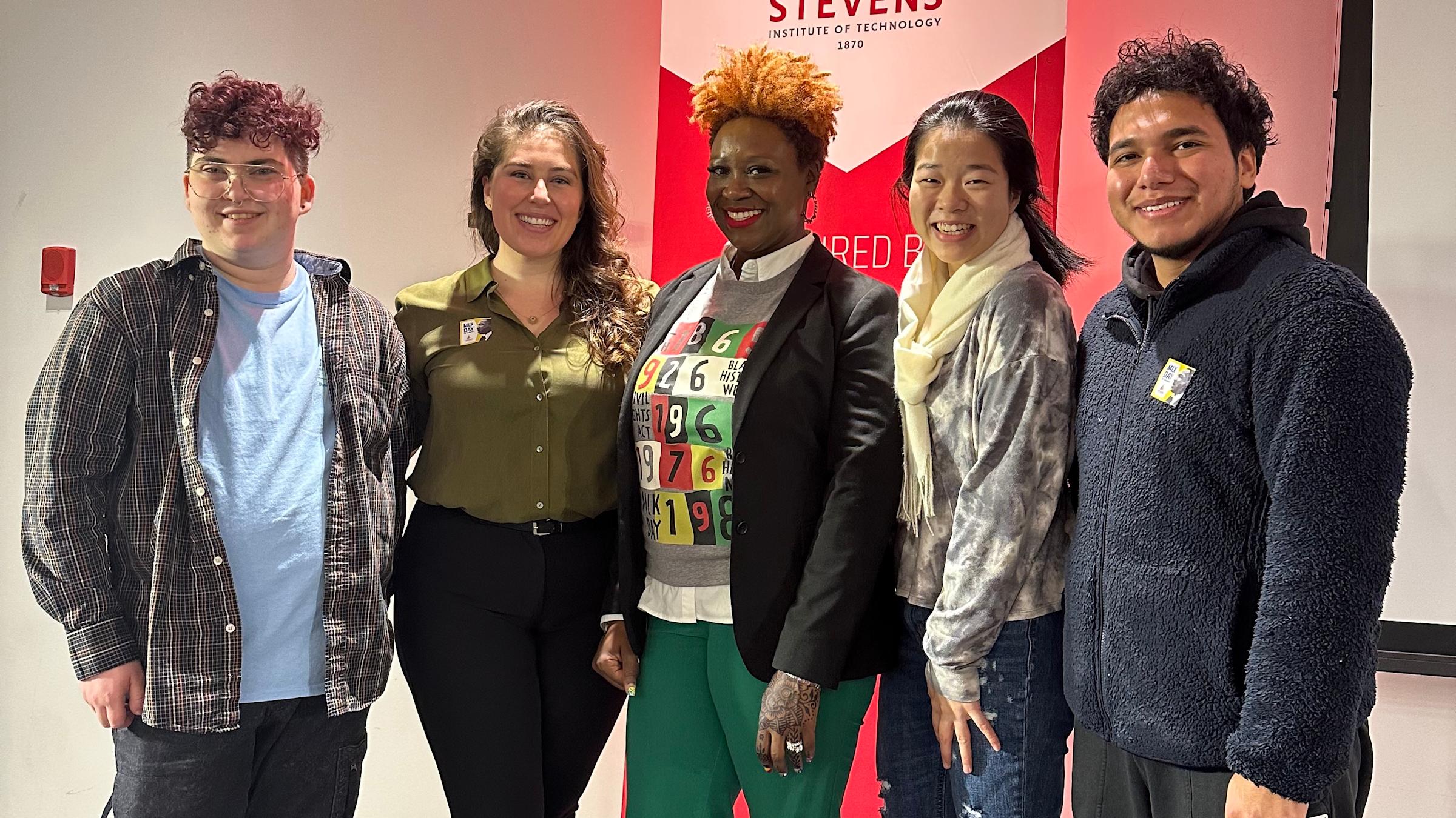 Stevens Director of Diversity, Equity and Inclusion Liliana Delman and keynote speaker Aisha Lawrey '99 pose with students