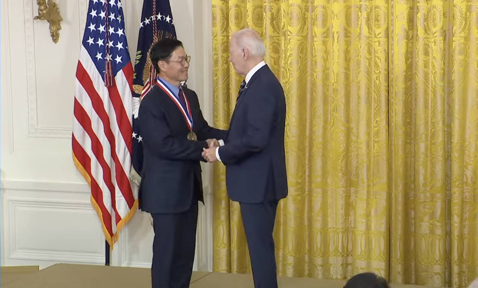 Stevens Honoree Jeong H. Kim H’12 receiving a medal from U.S. President Joe Biden at White House