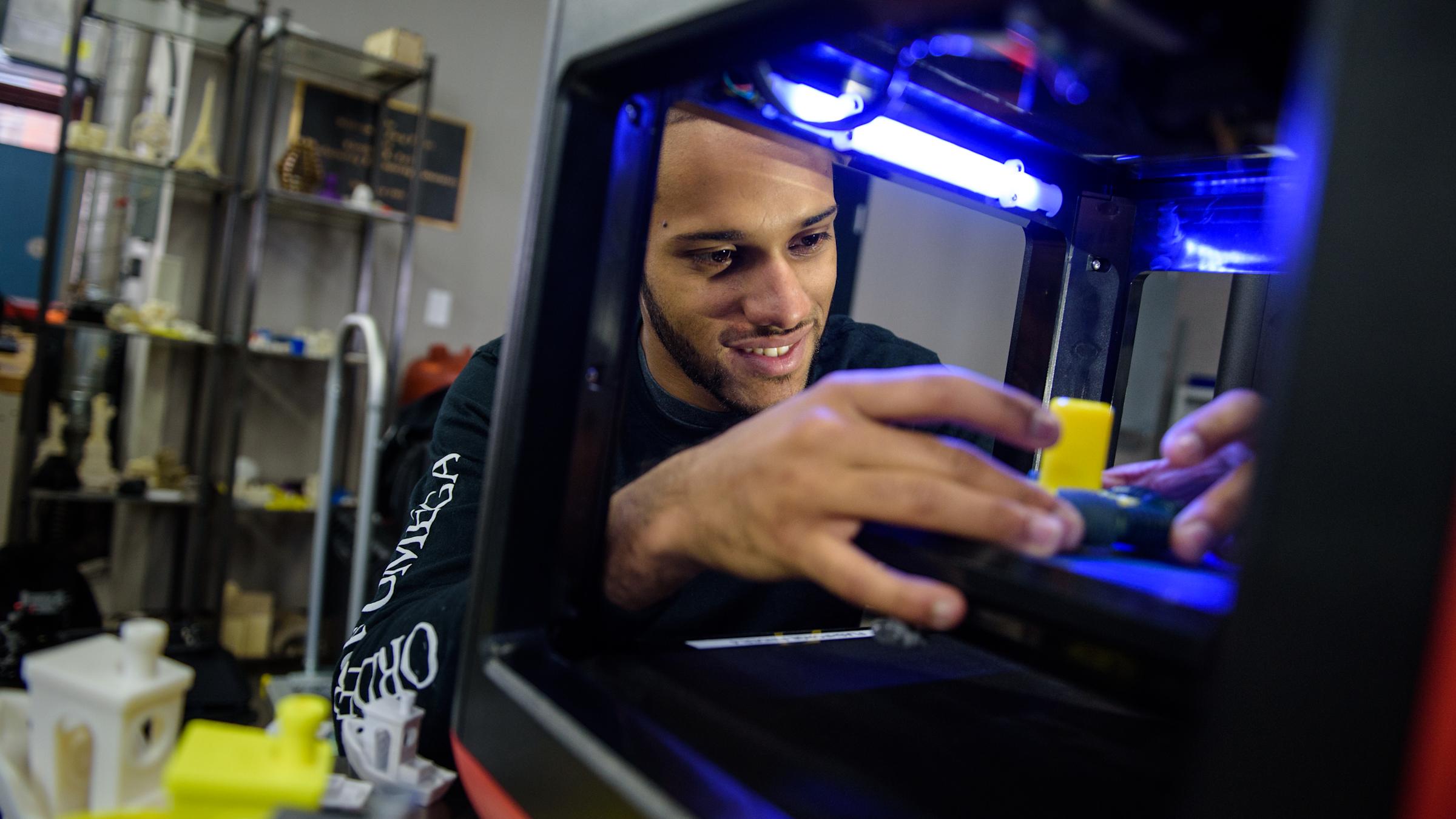 Male student working on an experiment