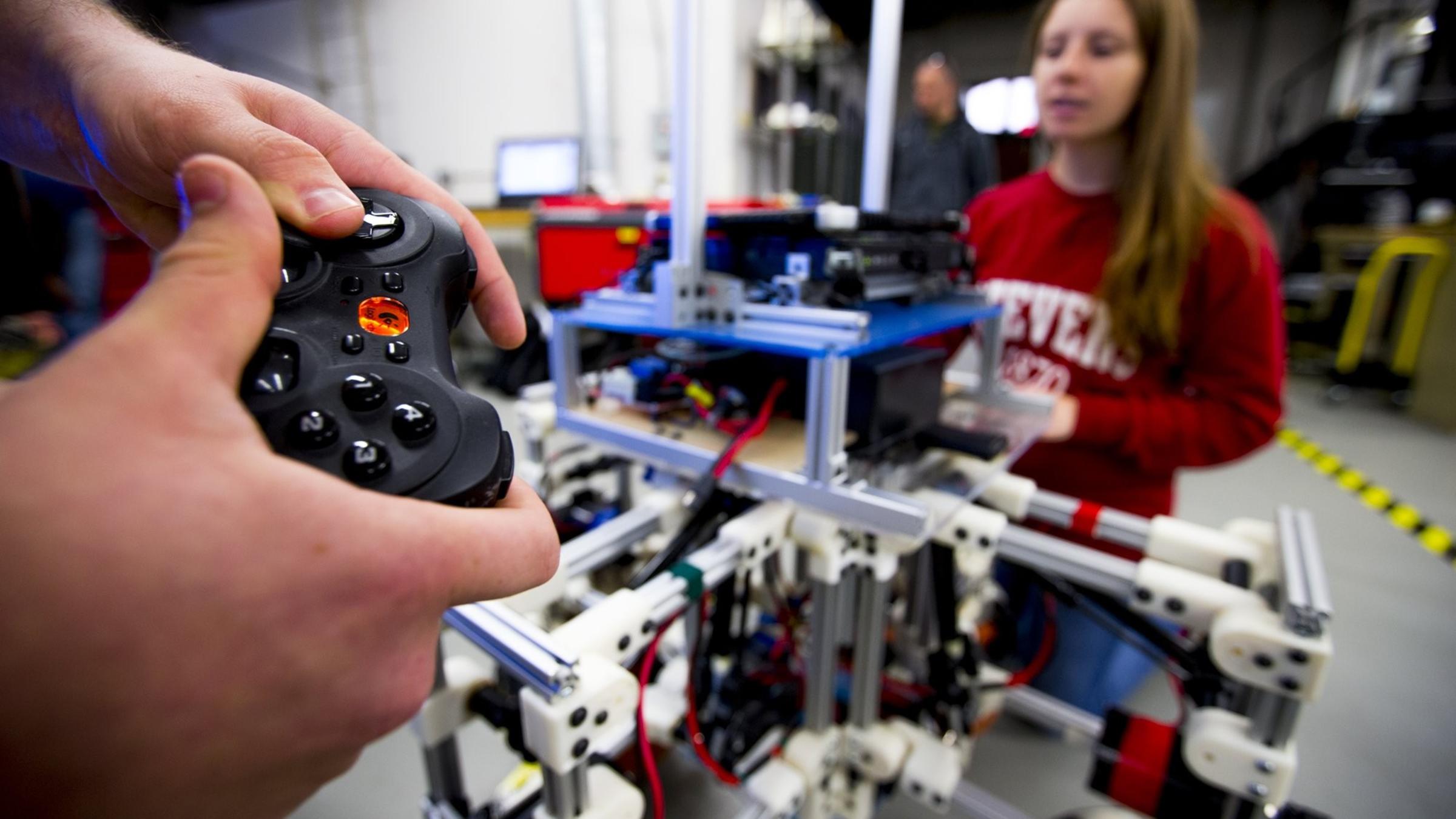 A closeup of students using remote controls