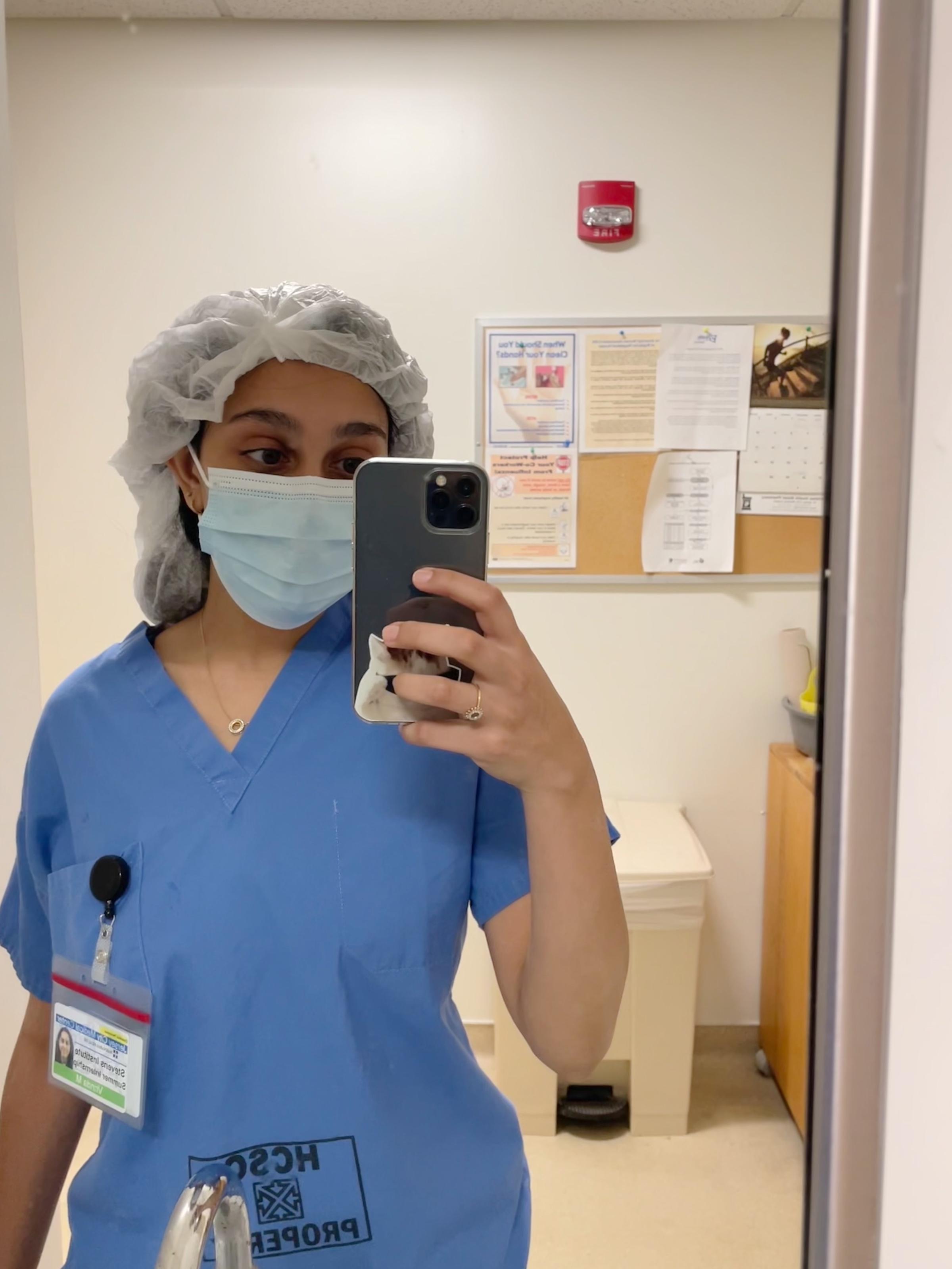 Photo of student Vrinda Modi in a mask and hairnet