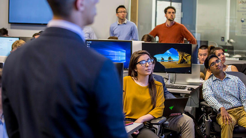 A classroom of students analyzing a stock portfolio