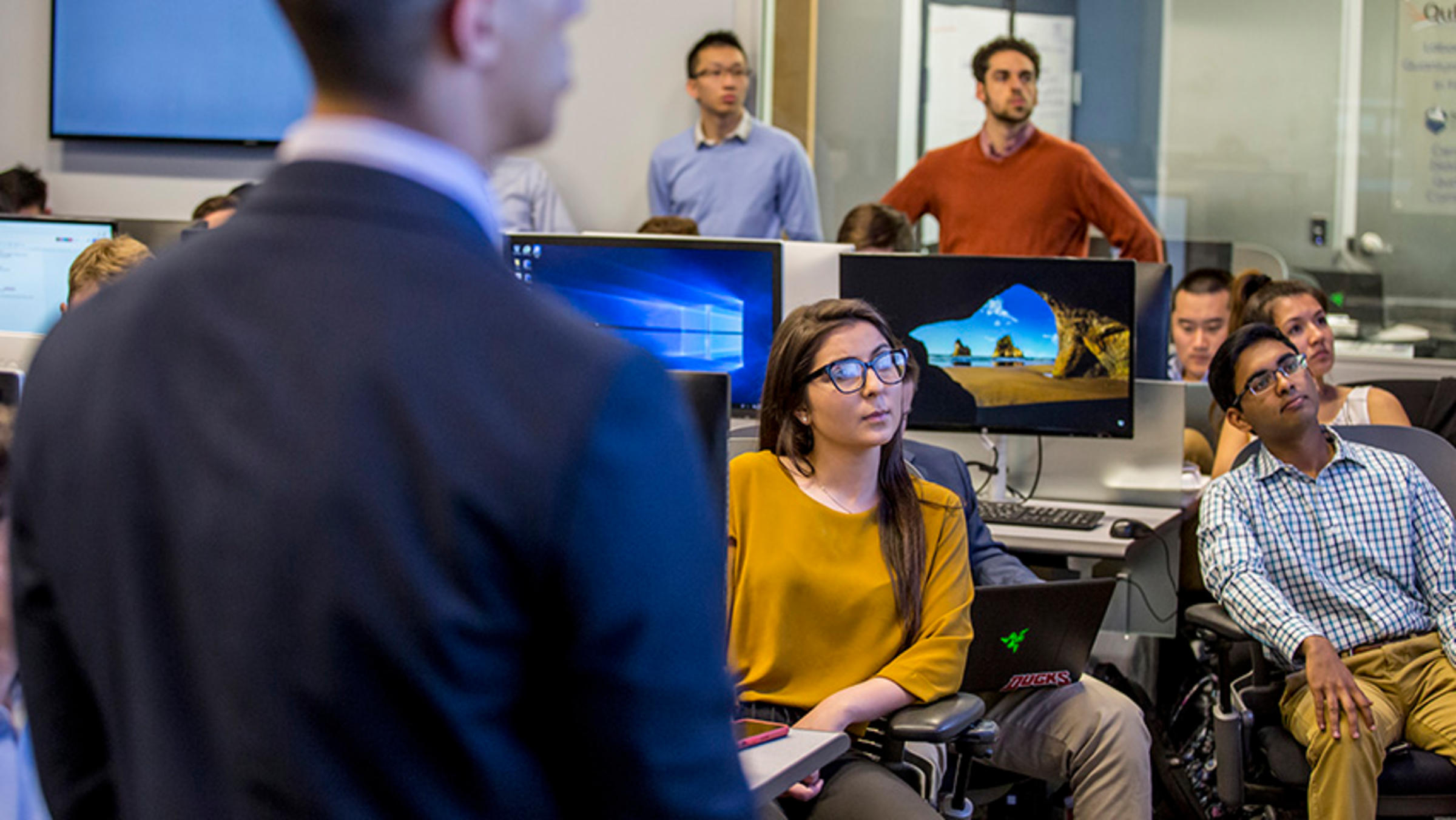A classroom of students analyzing a stock portfolio
