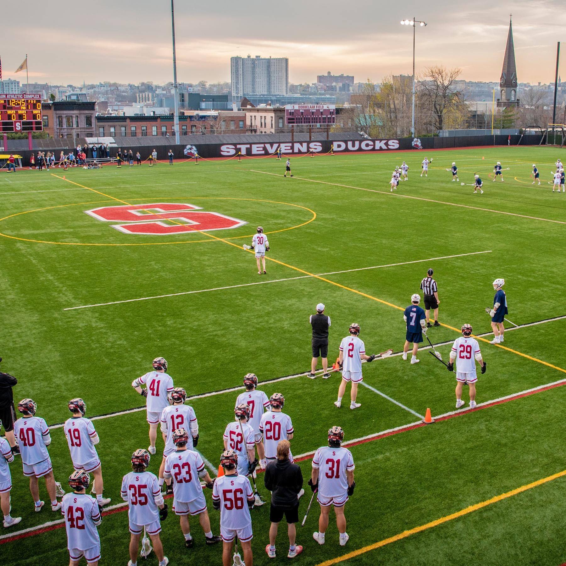 Stevens men's lacrosse team on the field.