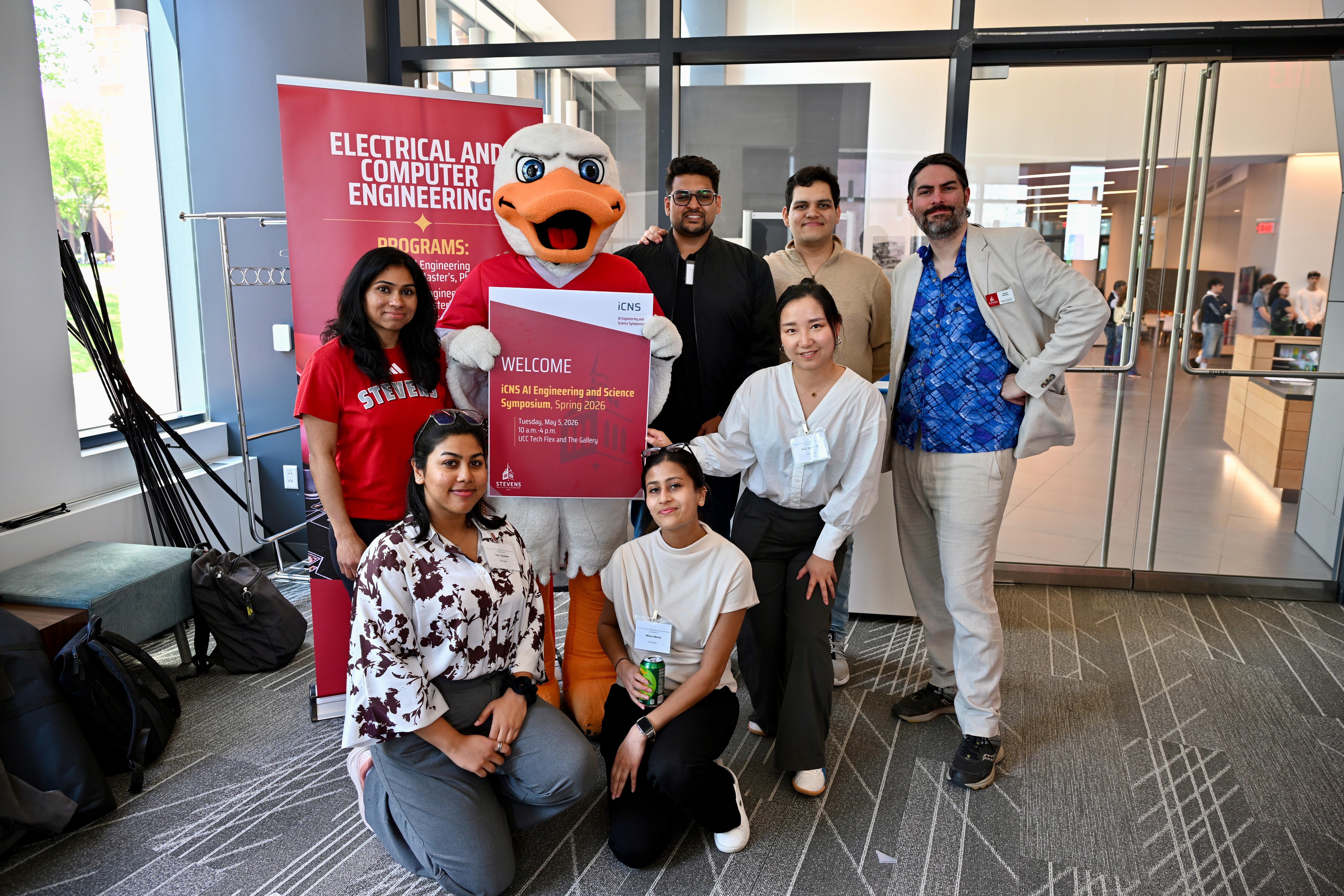 A group of students, professor Joseph Helsing and Attila pose to celebrate the iCNS Symposium.