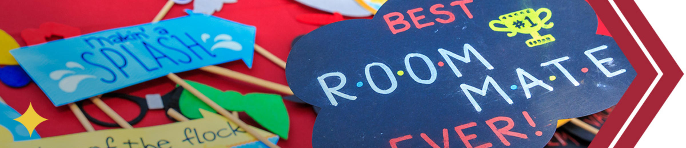 Handcrafted paper signs, with one that says "Best Roommate Ever!"