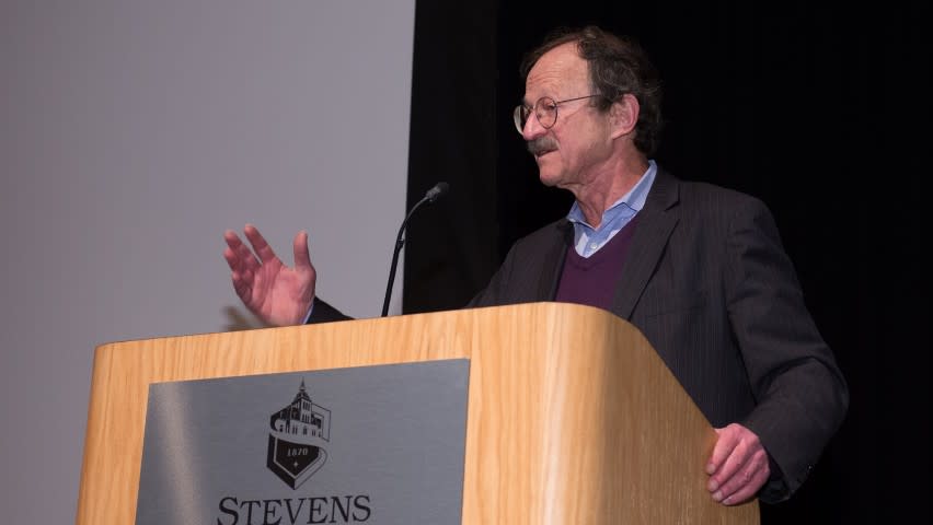 Dr. Harold Varmus giving a speech at a podium at Stevens Institute of Technology