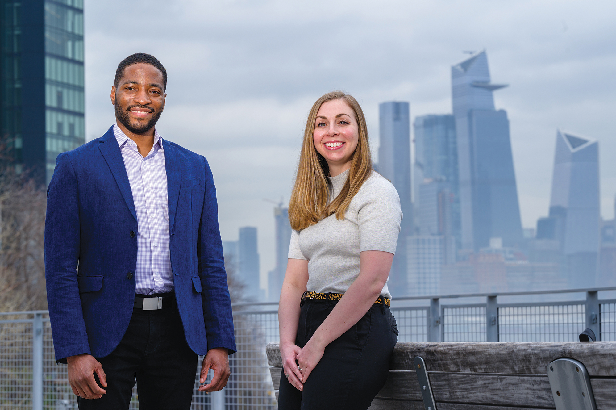 School of Systems and Enterprises professor Philip Odonkor and graduate student Danielle Preziuso standing on campus in front of the New York skyline.