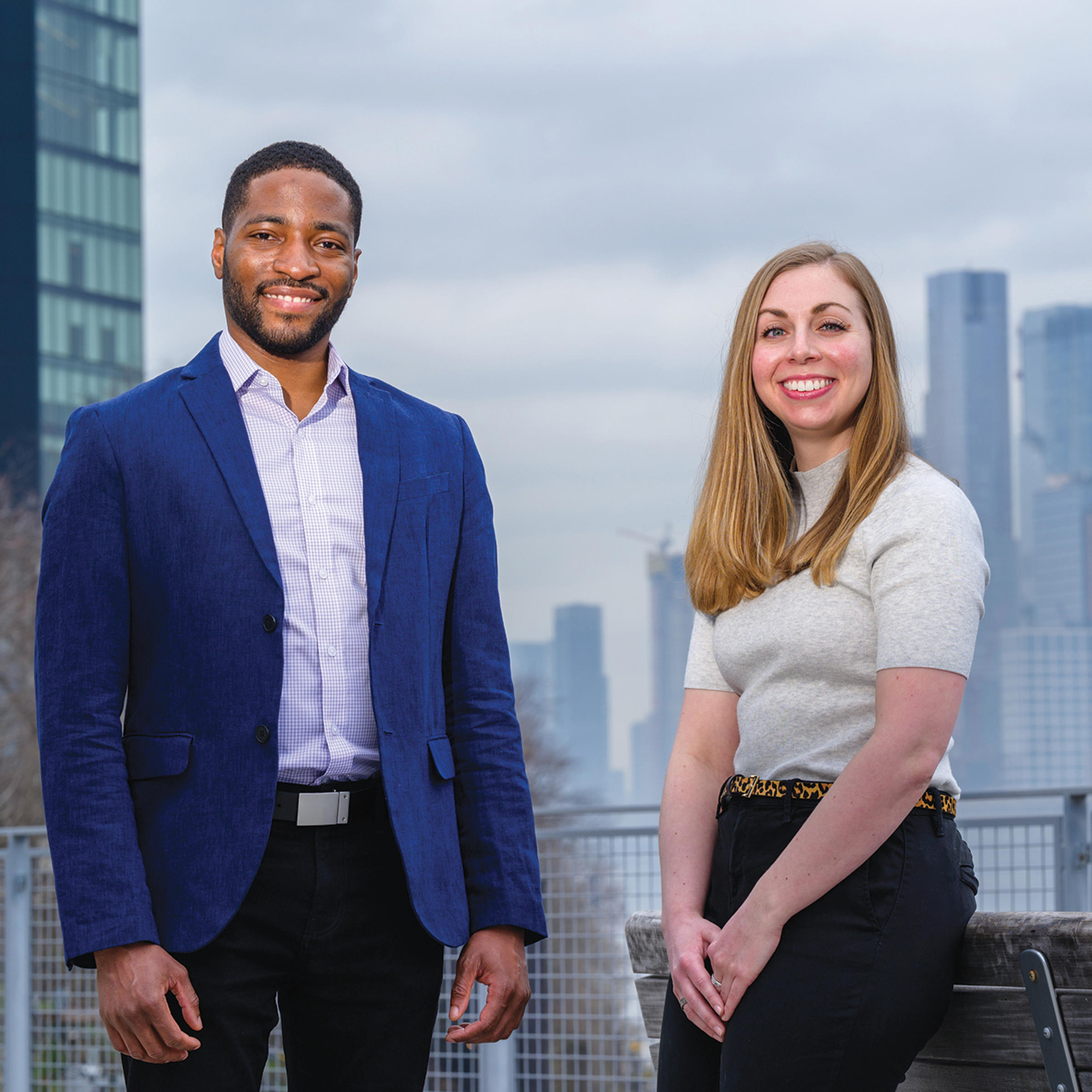 School of Systems and Enterprises professor Philip Odonkor and graduate student Danielle Preziuso standing on campus in front of the New York skyline.