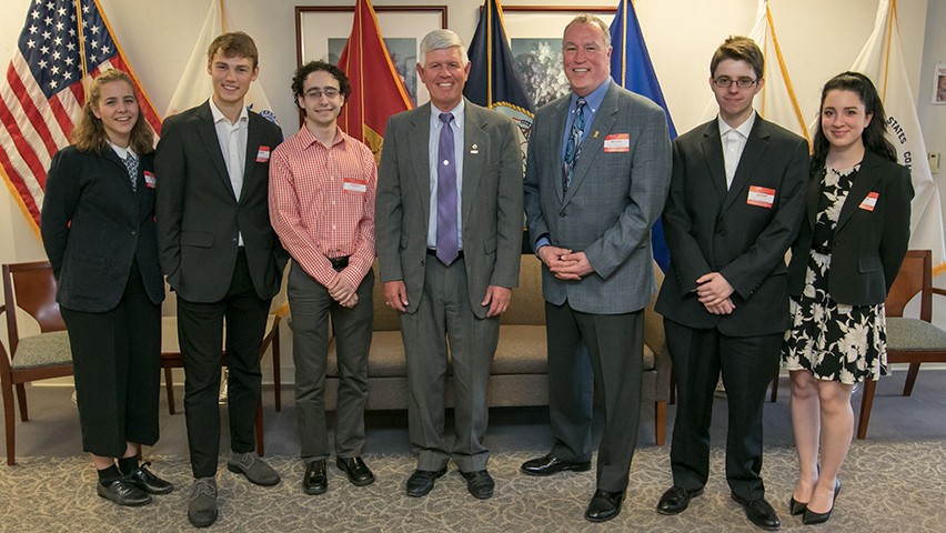 Stevens students presenting a business plan to Vets4Warriors in Piscataway.