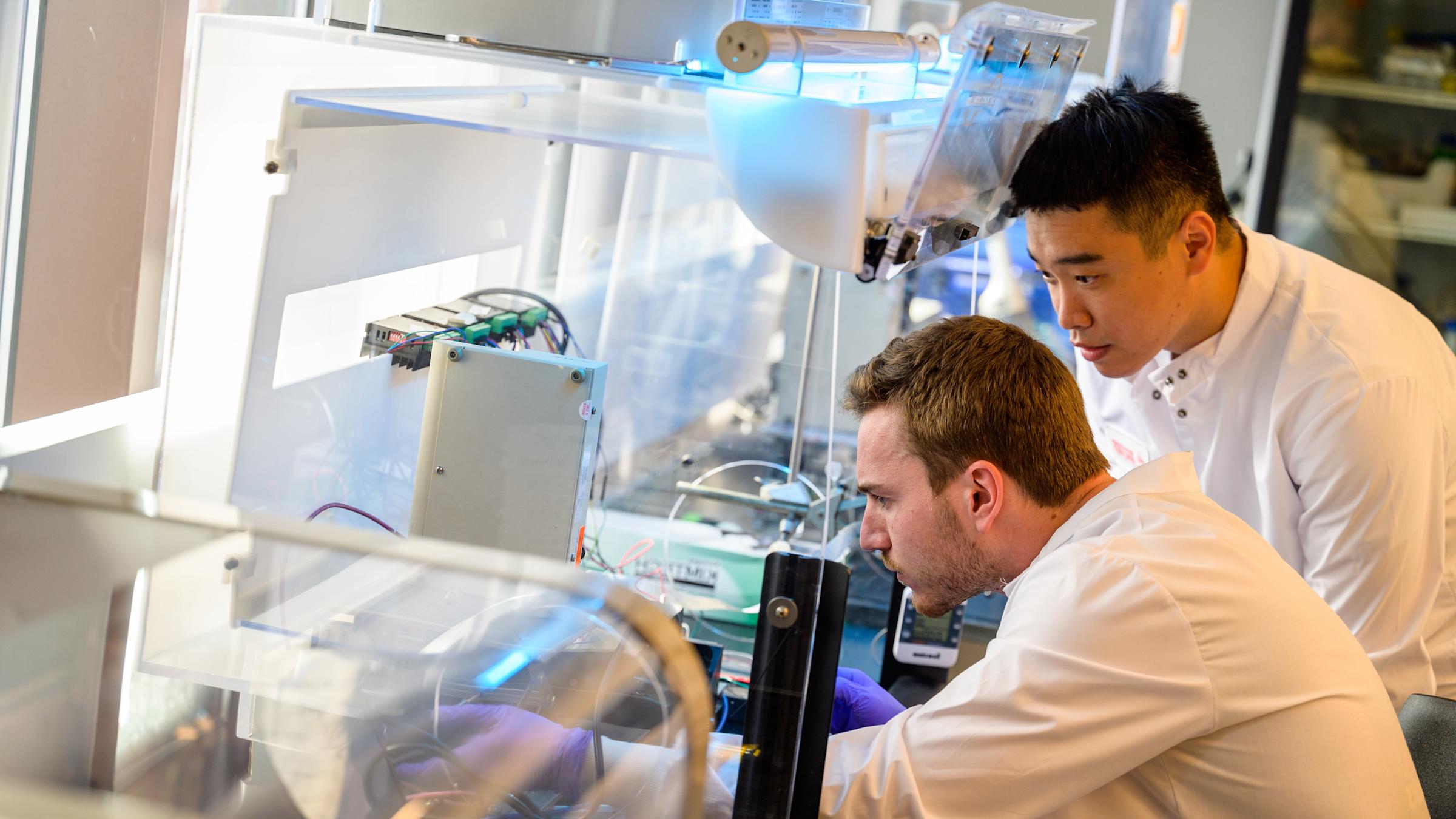 Two biomedical engineering Ph.D. students working in the Center for Healthcare Innovation tissue engineering laboratory