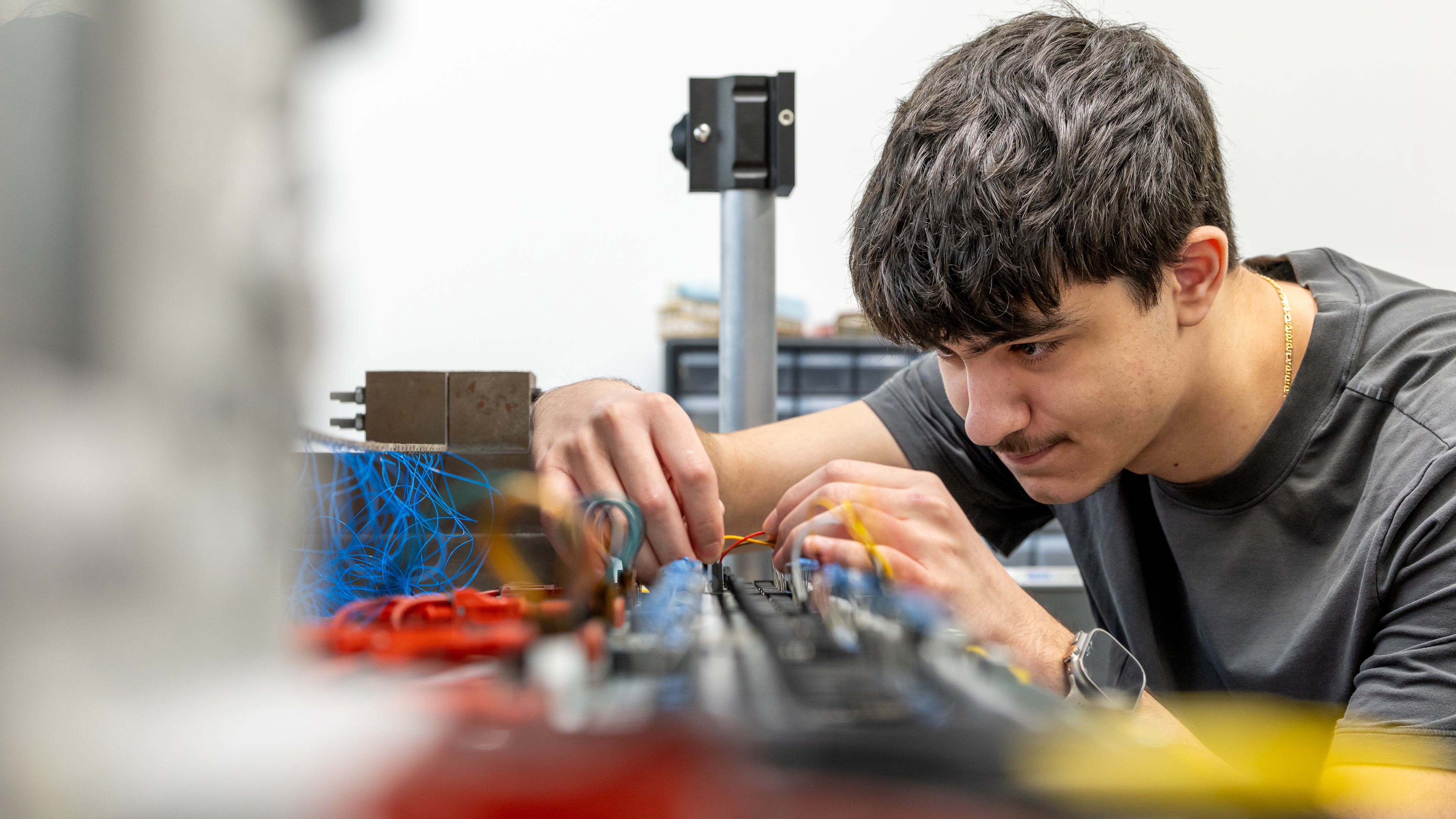 Student working with electronic components in an engineering lab