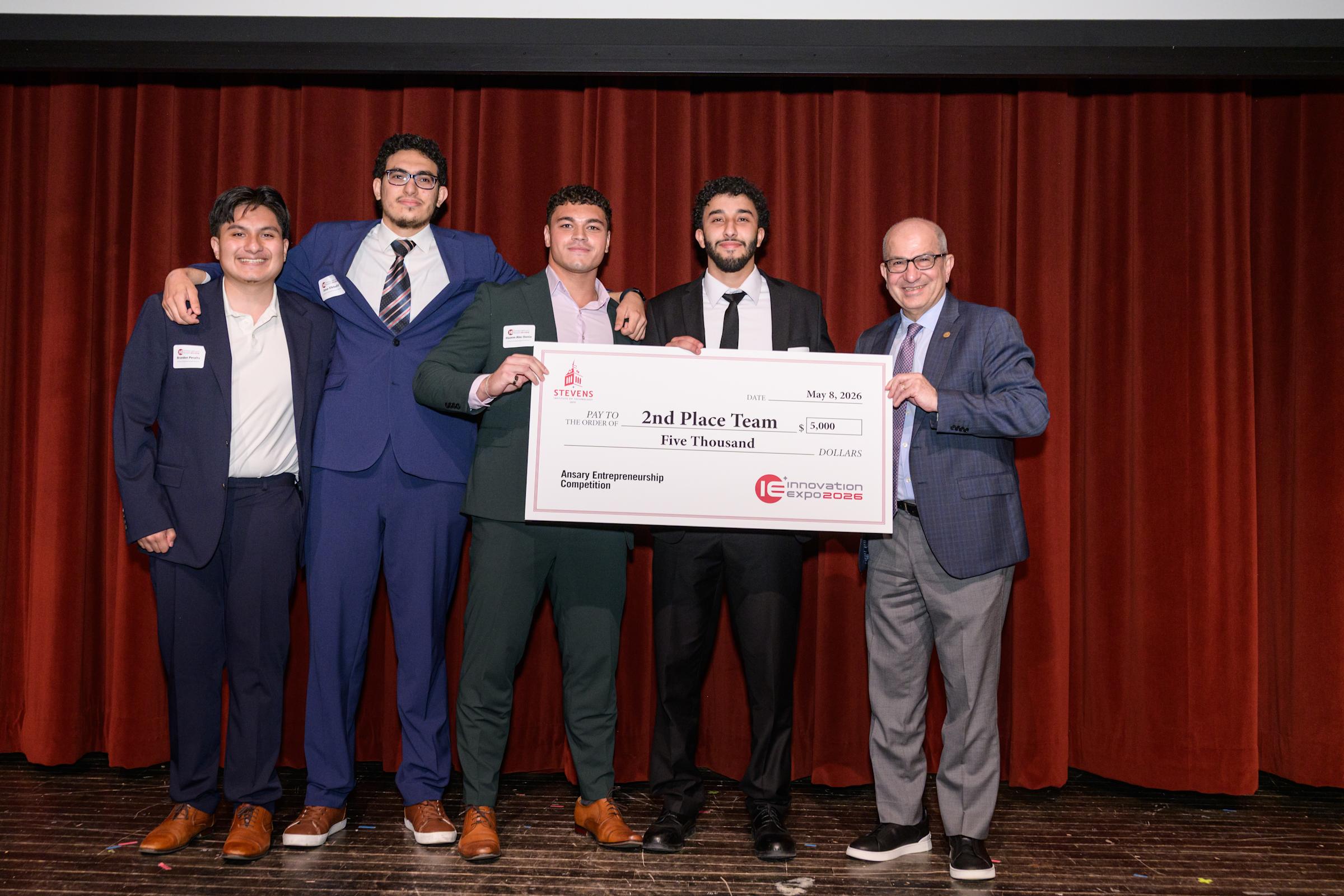 The CTRL team receives its prize for second place in the Ansary Competition