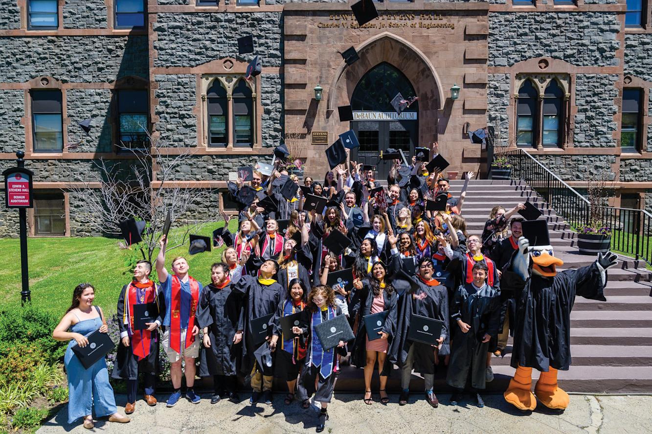 Group of Alumni in front of EAS building.
