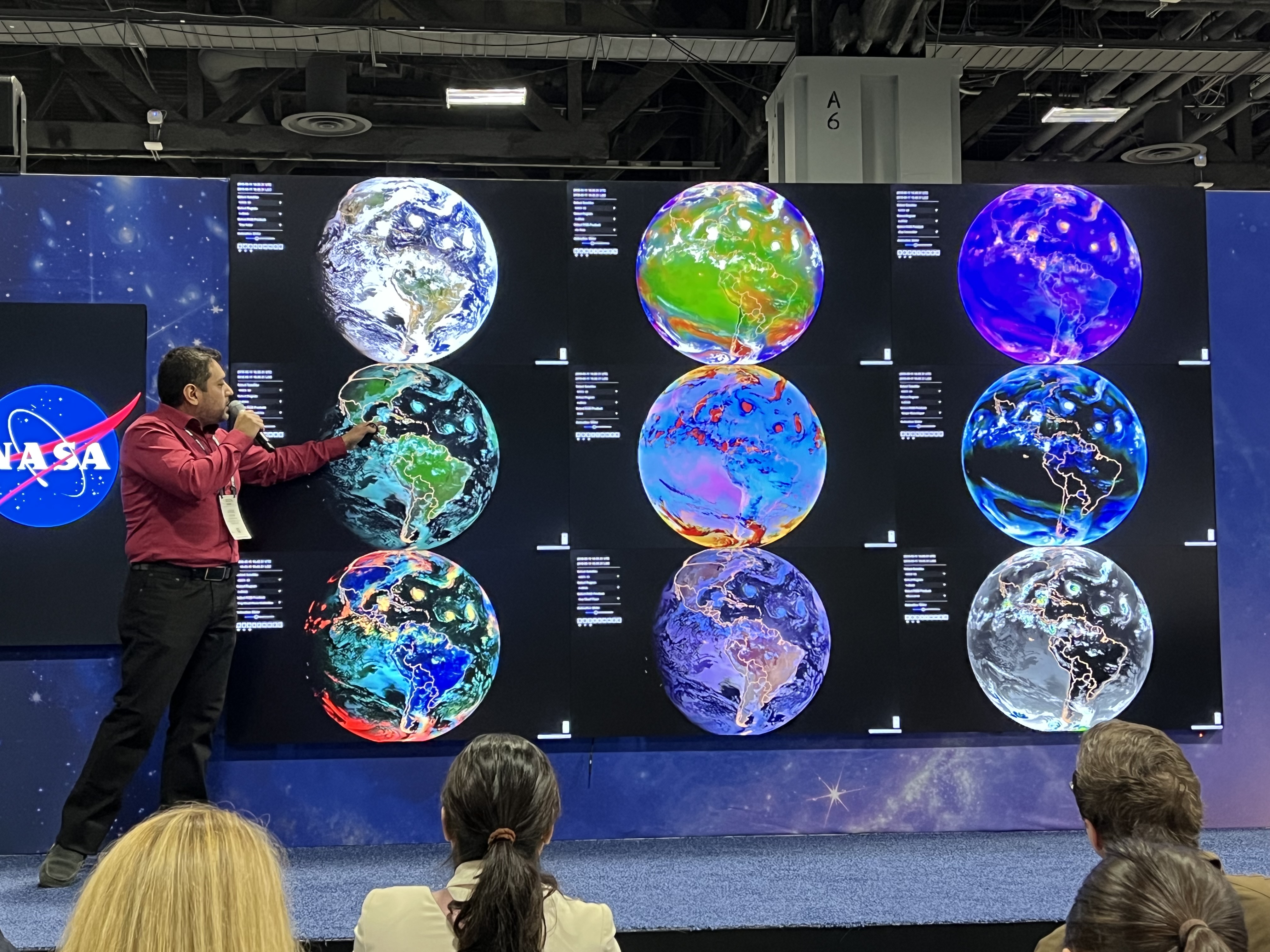 Stevens PH.D. student Jorge bravo presents a slide displaying weather patterns on planet Earth.