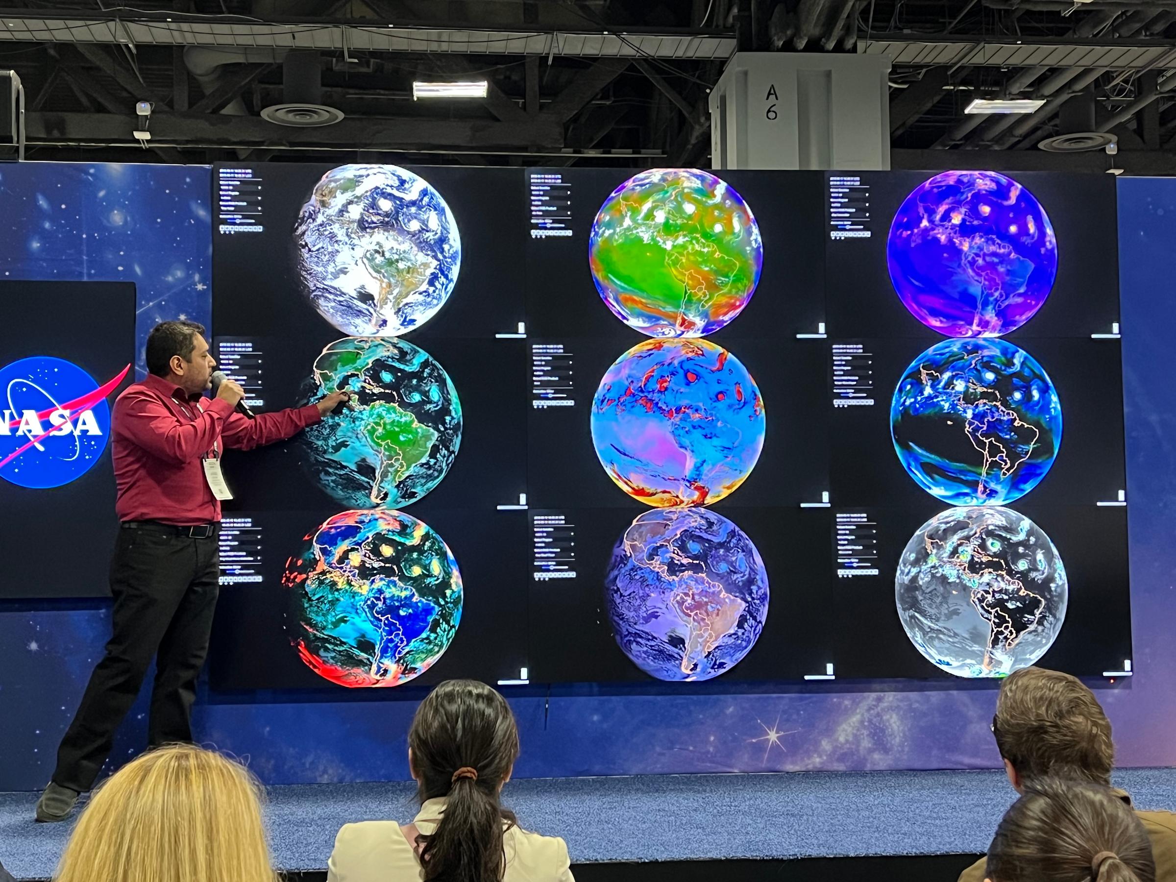 Stevens PH.D. student Jorge bravo presents a slide displaying weather patterns on planet Earth.
