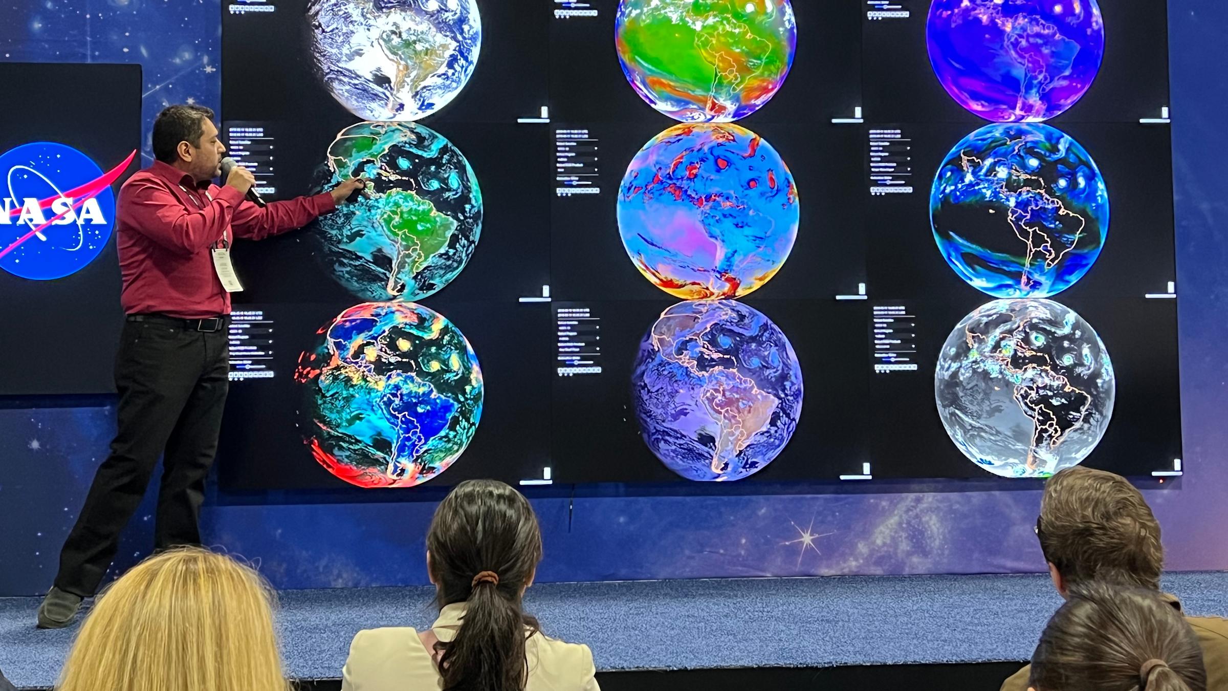 Stevens PH.D. student Jorge bravo presents a slide displaying weather patterns on planet Earth.