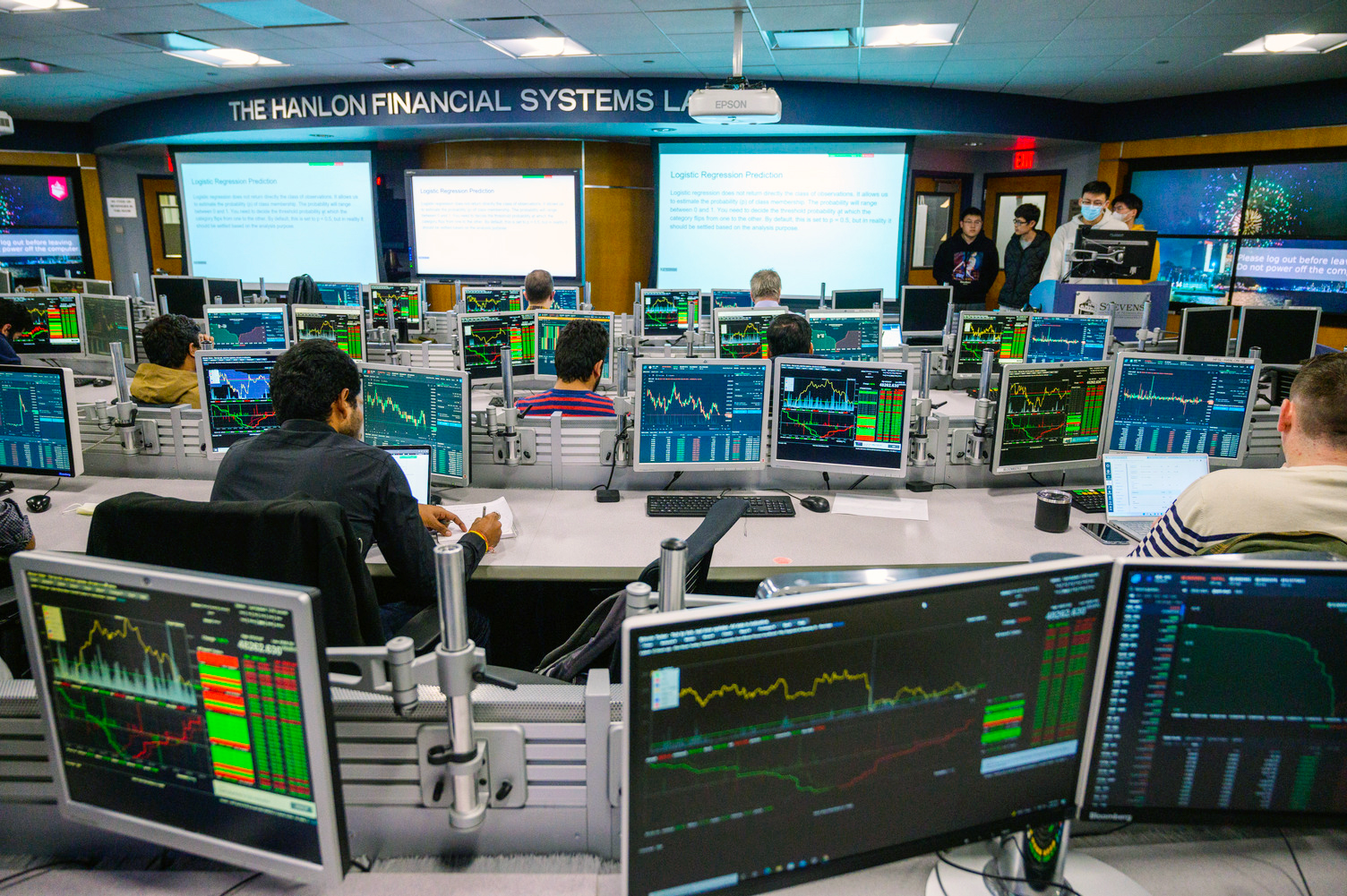 computer monitors showing financial data