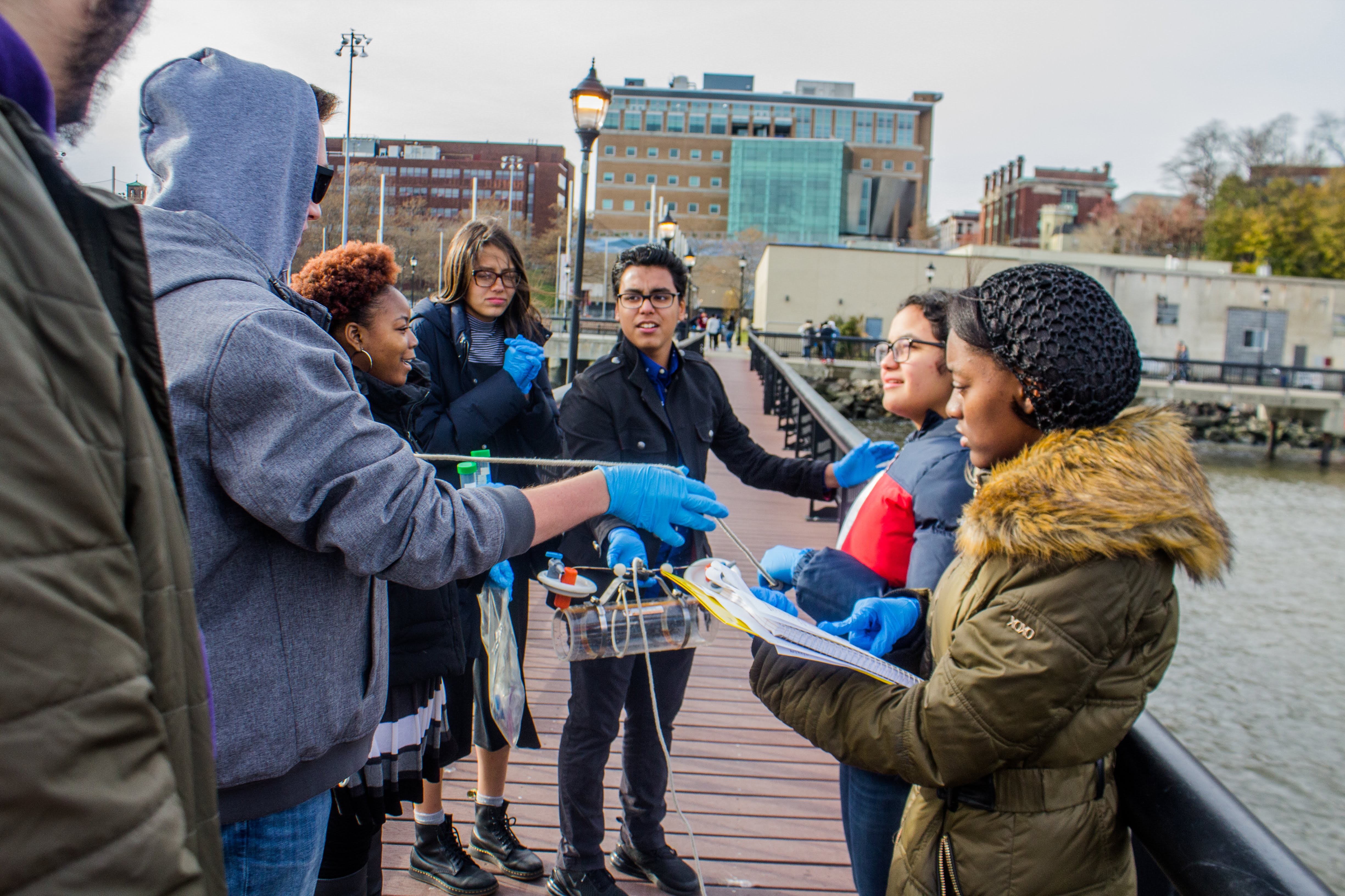 Group of Art Harper Saturday Academy students working outside on a project