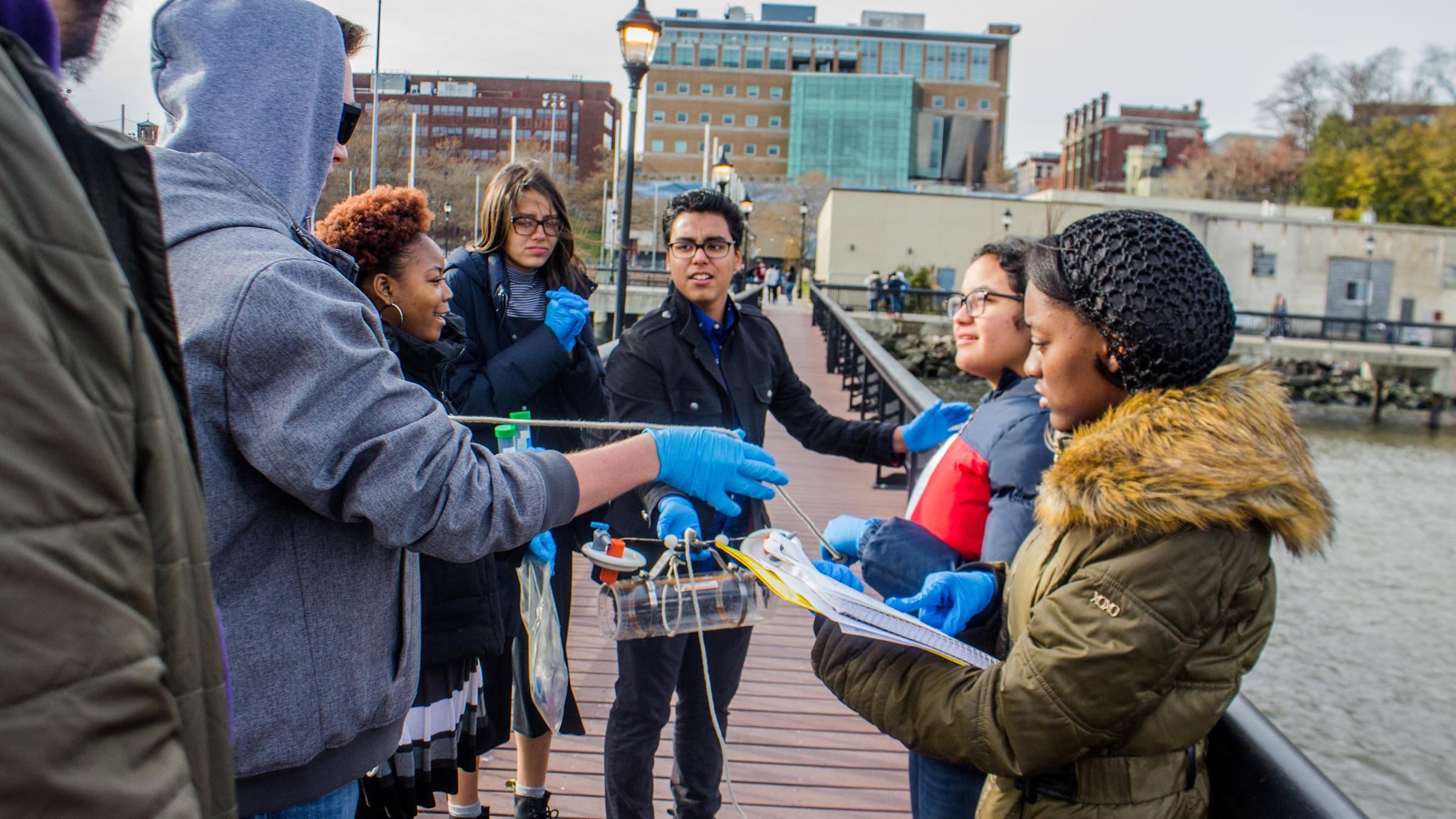 Group of Art Harper Saturday Academy students working outside on a project