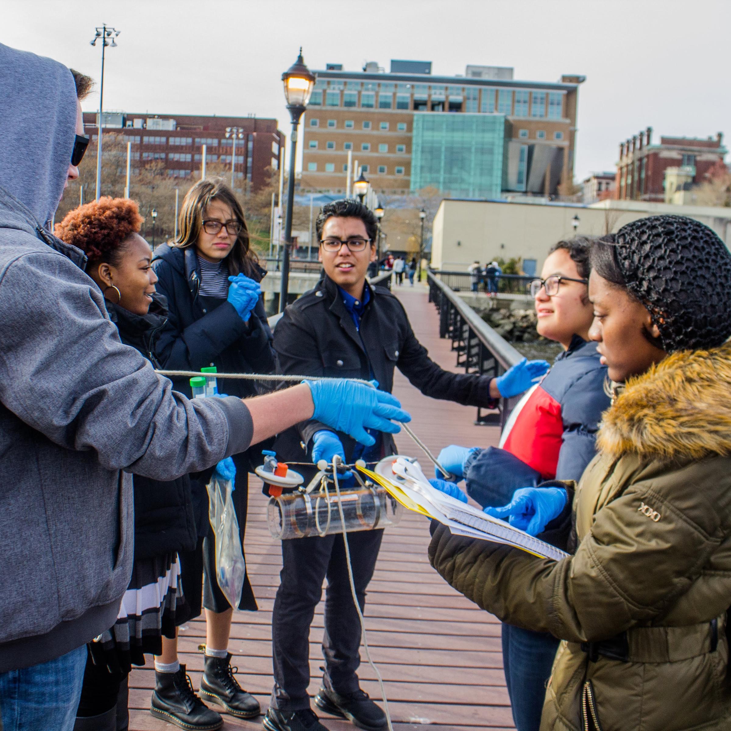 Group of Art Harper Saturday Academy students working outside on a project