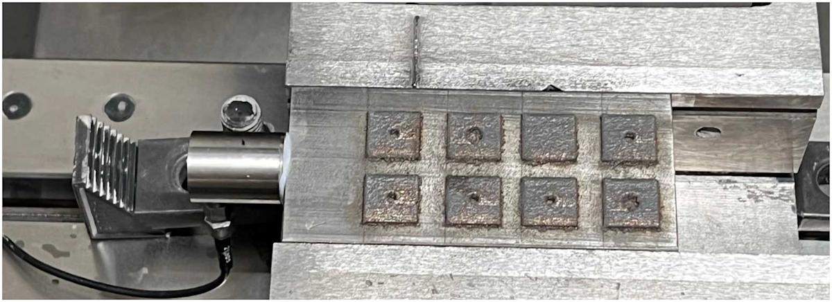 Optomec LDED machine chamber with an integrated AE sensor. 