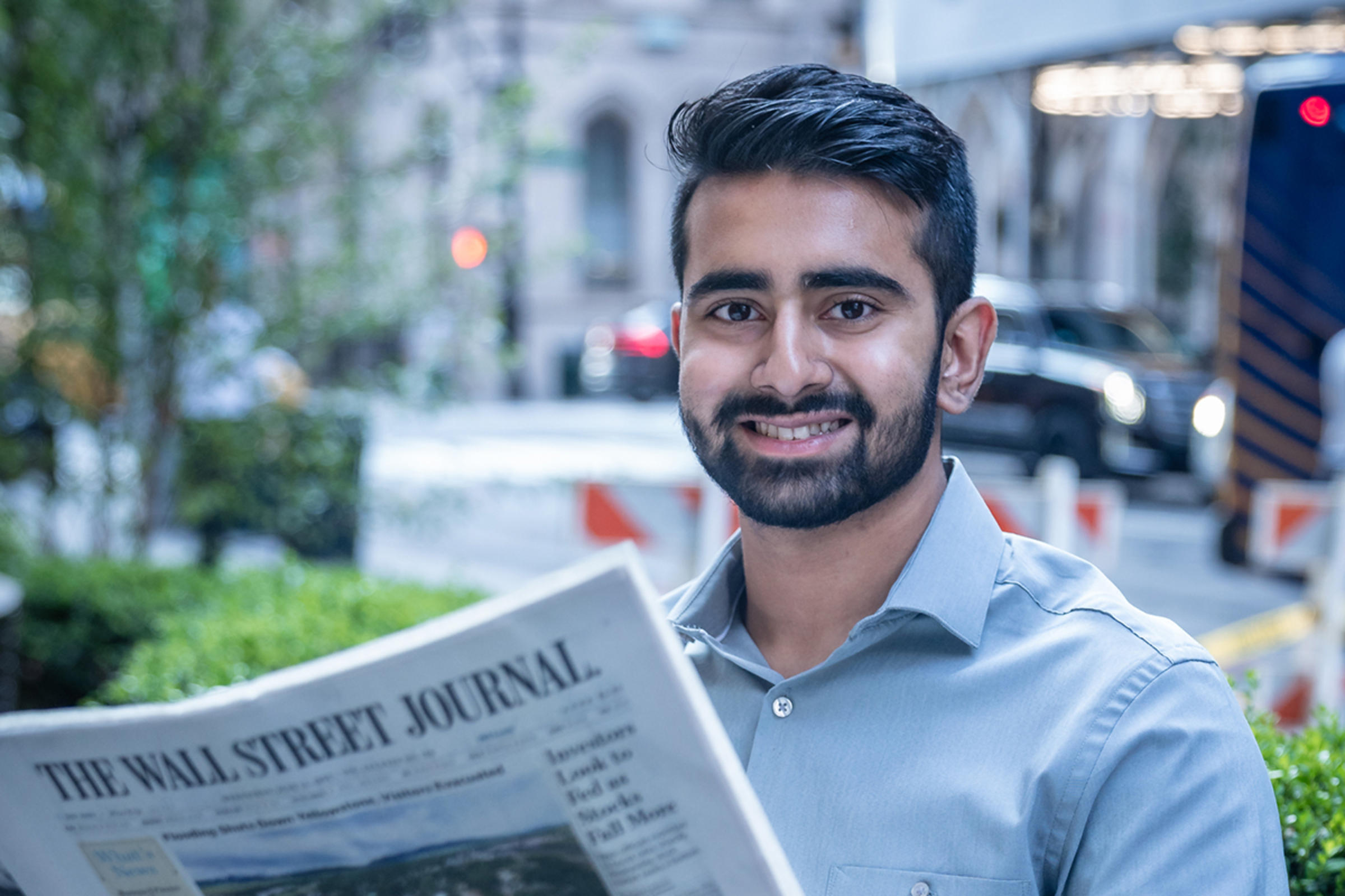 George Alapatt reading Wall Street Journal