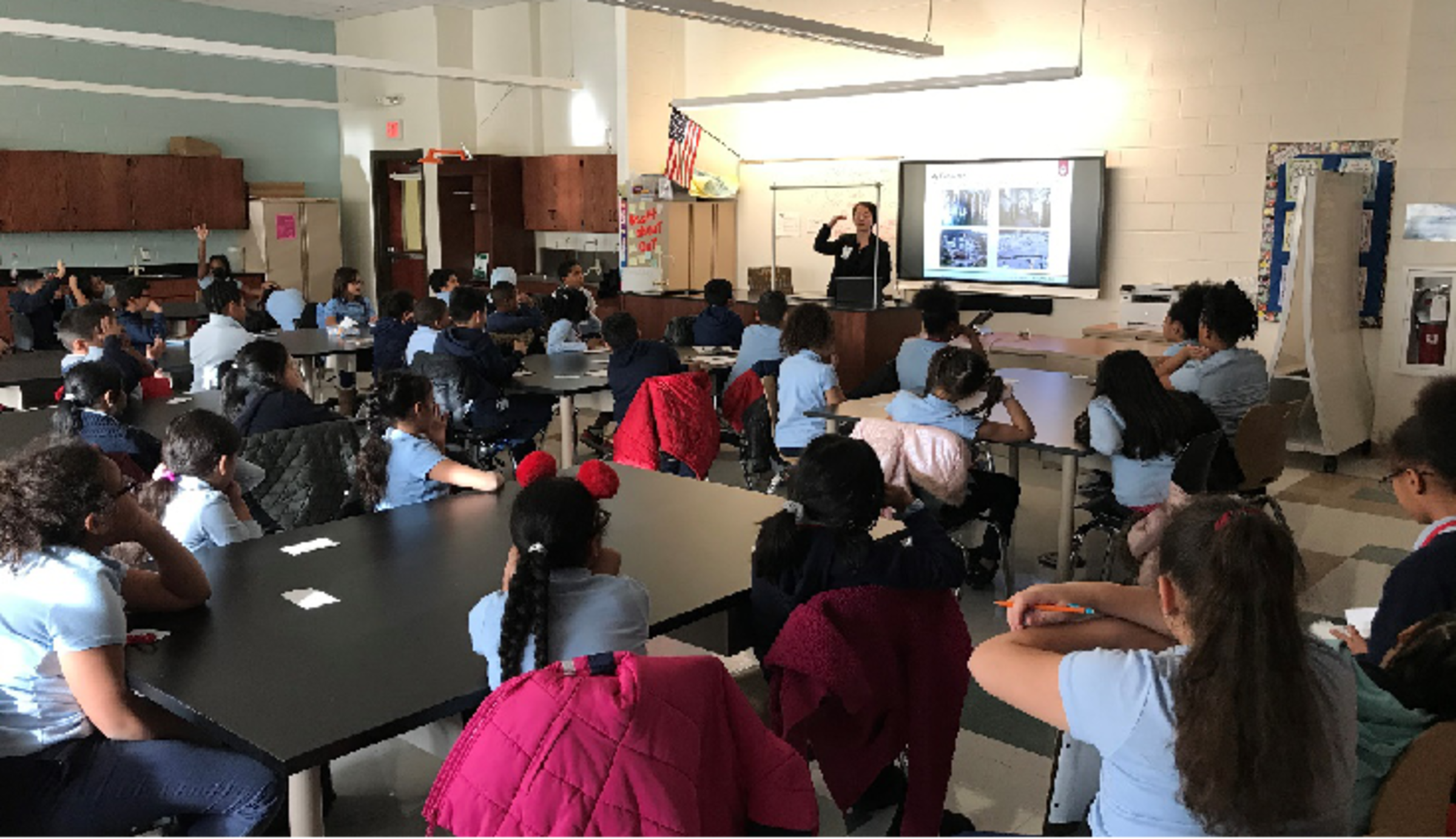 Weina Meng speaking to primary school students