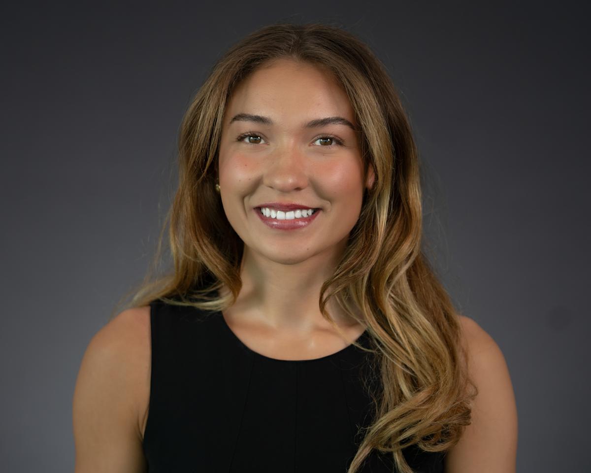 Headshot of Quincy Connell wearing professional attire.