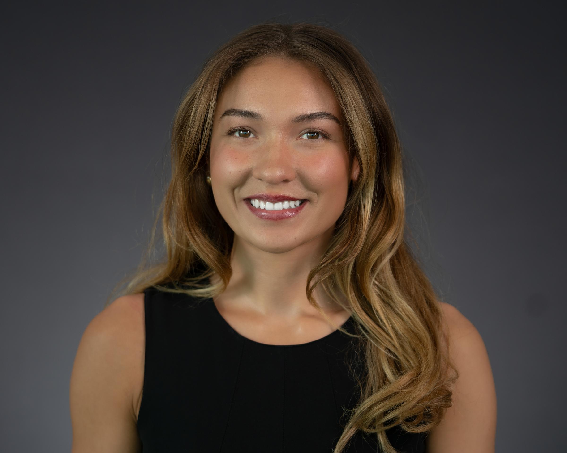 Headshot of Quincy Connell wearing professional attire.