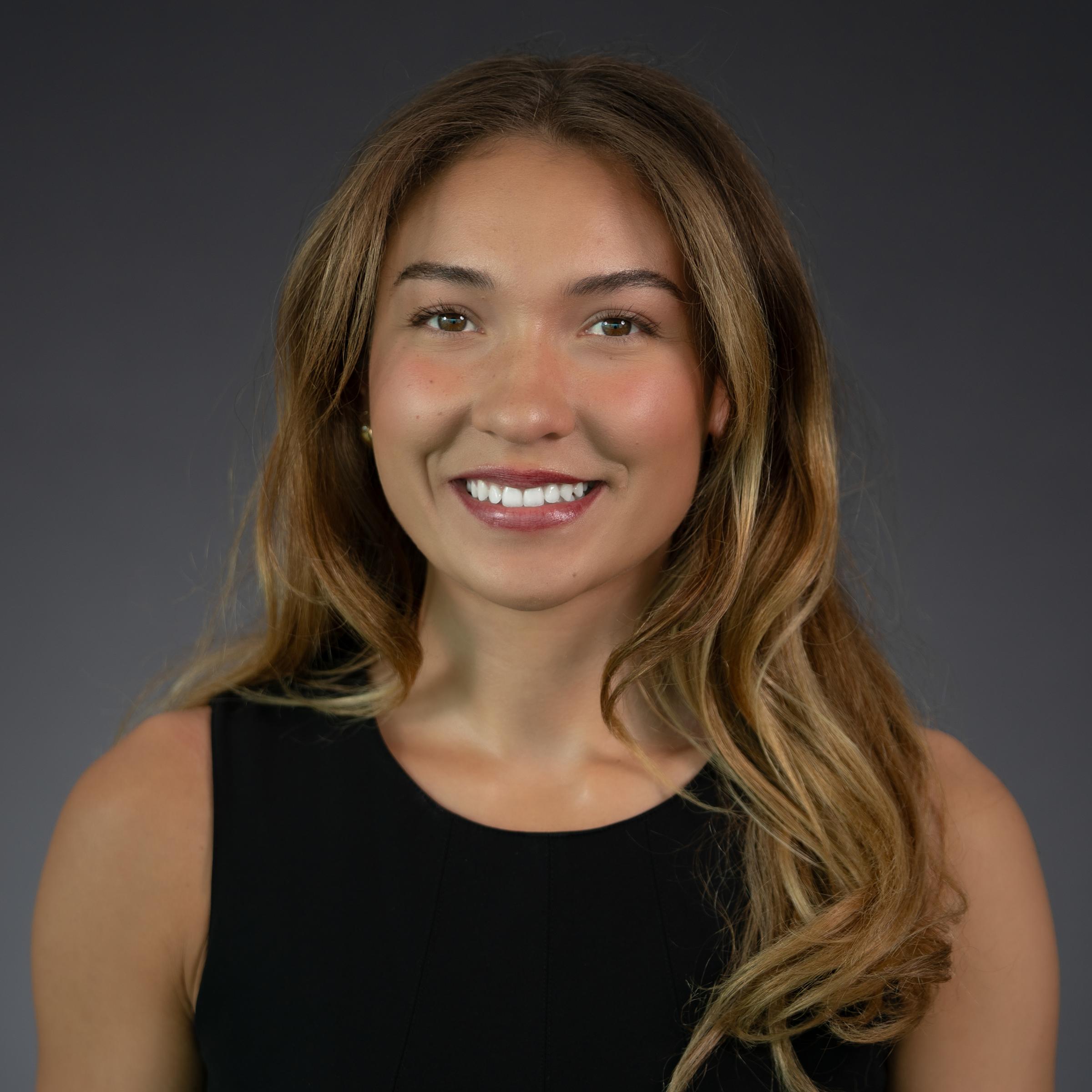 Headshot of Quincy Connell wearing professional attire.