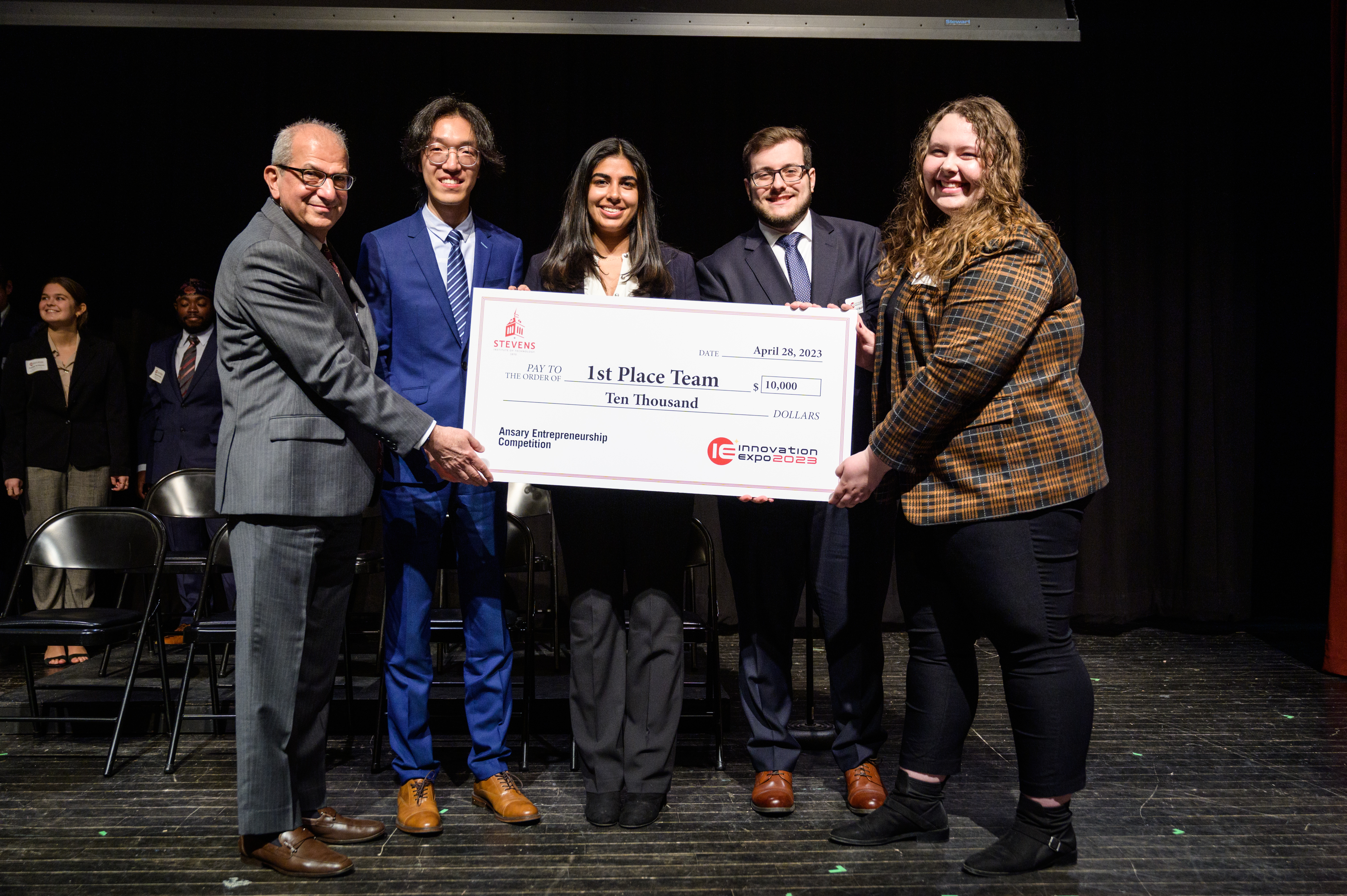 The victorious Maritime Security team poses with Stevens President Nariman Farvardin following the 2023 Ansary Entrepreneurship Competition. From left to right next to Farvardin: Dehan Kong, Reva Grover, Daniel Wadler and Samantha Weckesser. 