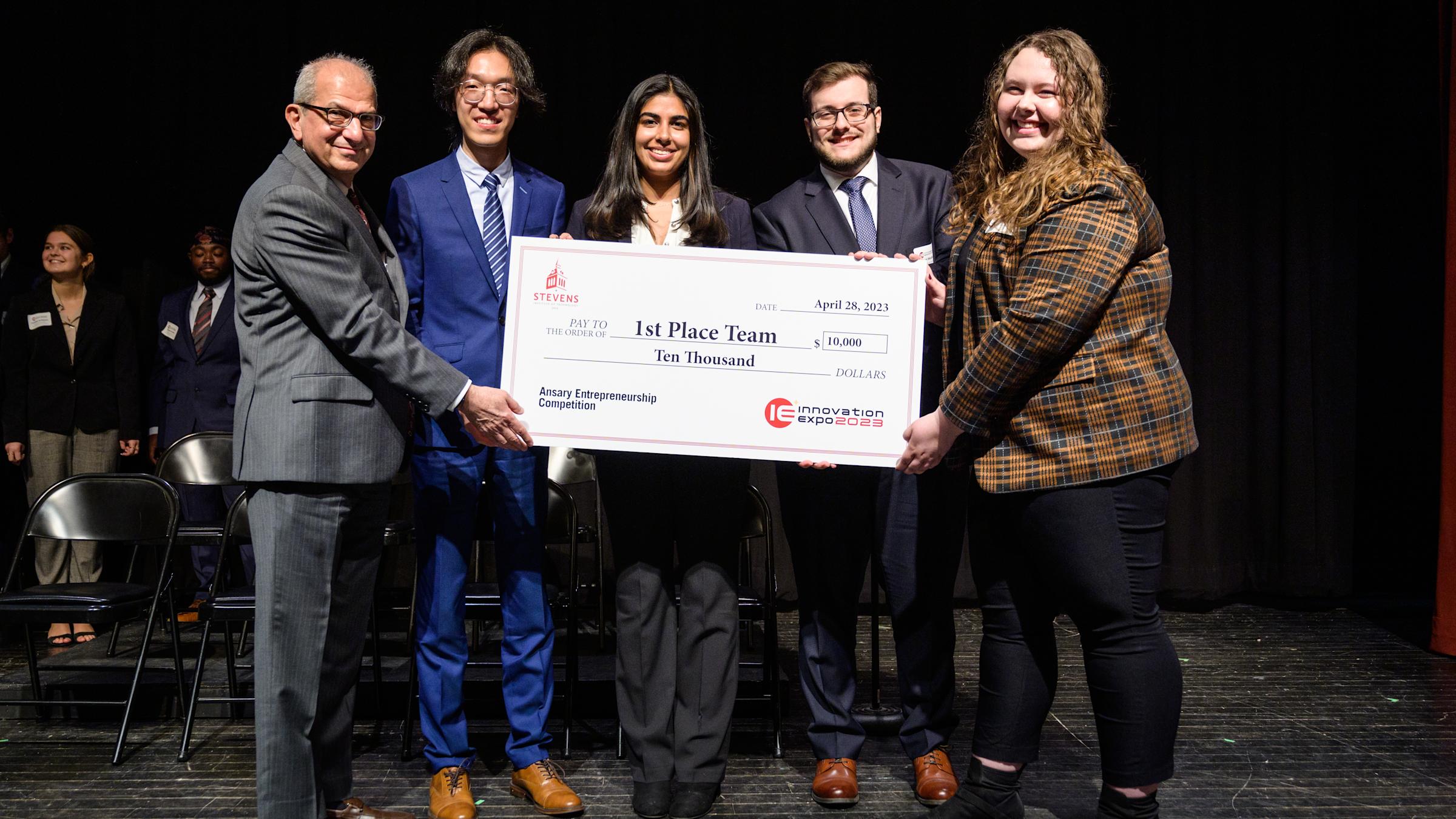 The victorious Maritime Security team poses with Stevens President Nariman Farvardin following the 2023 Ansary Entrepreneurship Competition. From left to right next to Farvardin: Dehan Kong, Reva Grover, Daniel Wadler and Samantha Weckesser.