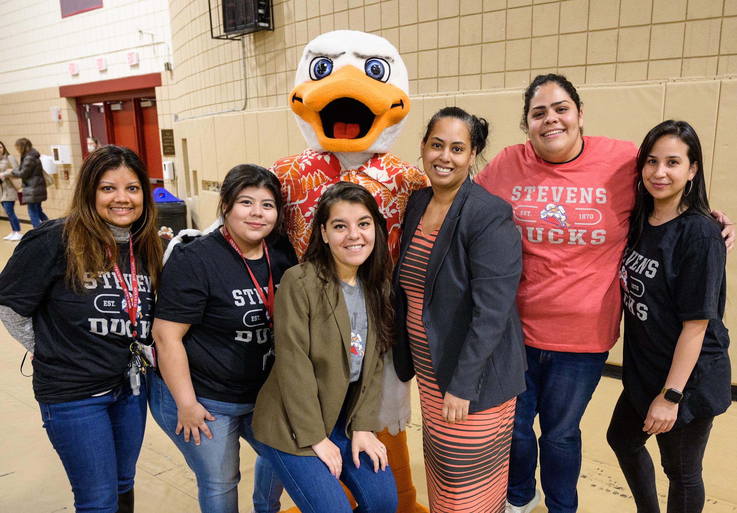 Stevens staff members pose with Attila