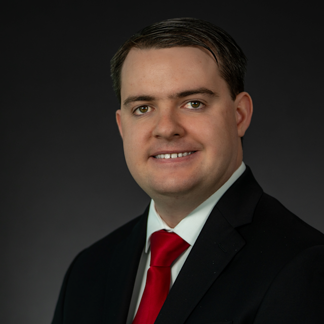 Headshot of Robert Dahill wearing professional attire.