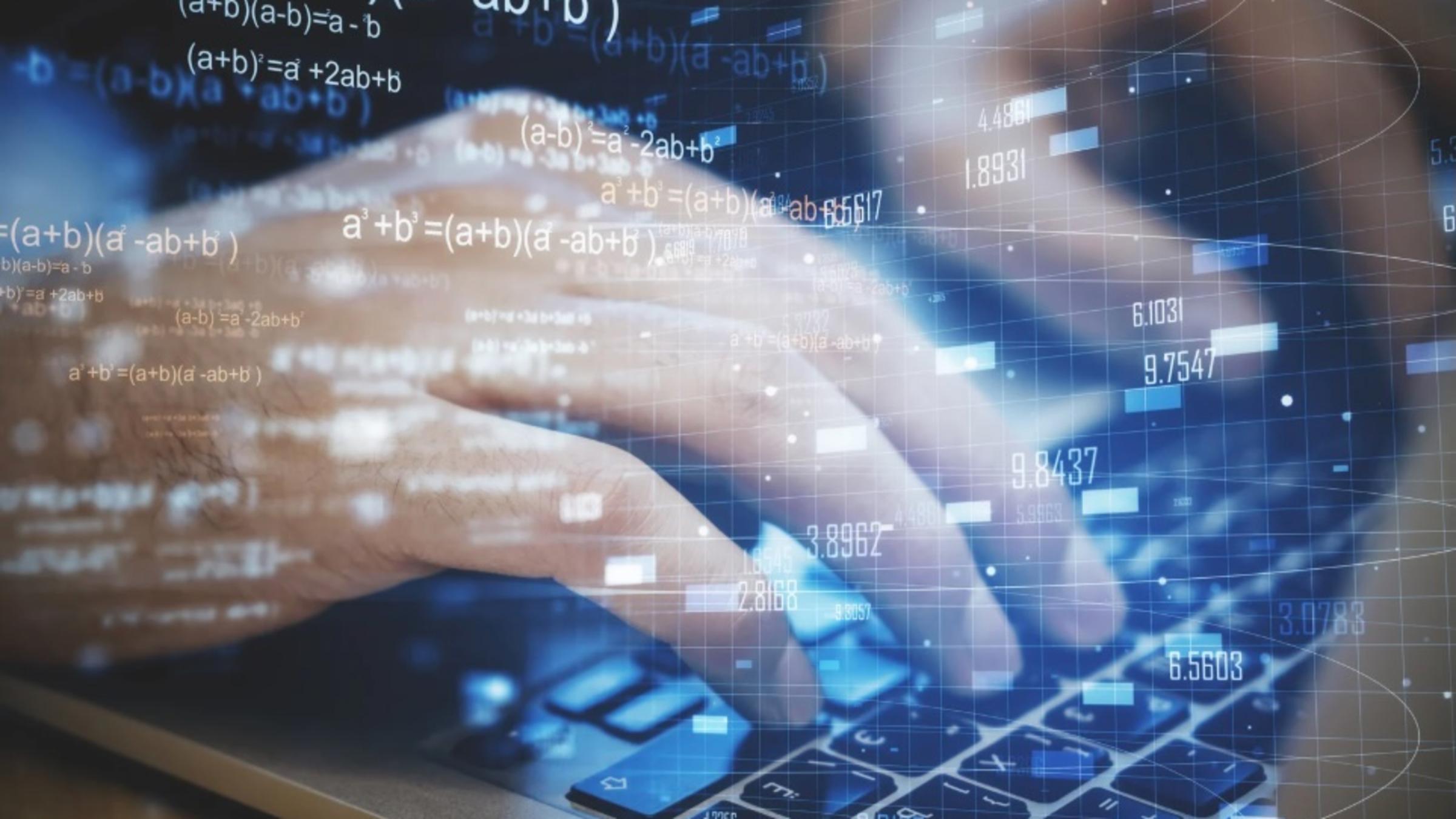 Hands on a laptop with forex chart and mathematical formulas