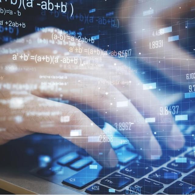 Hands on a laptop with forex chart and mathematical formulas