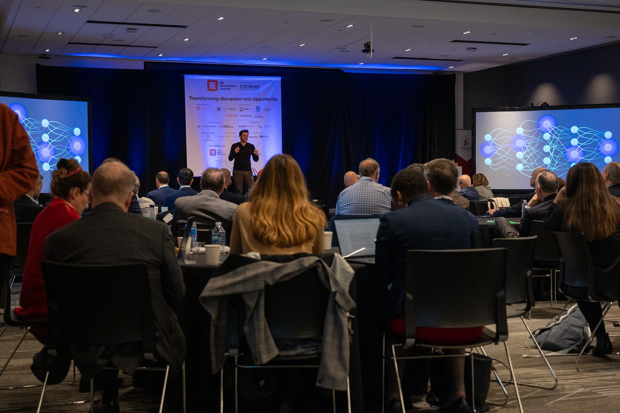 Urban in front of an audience of presidents, chancellors and provosts