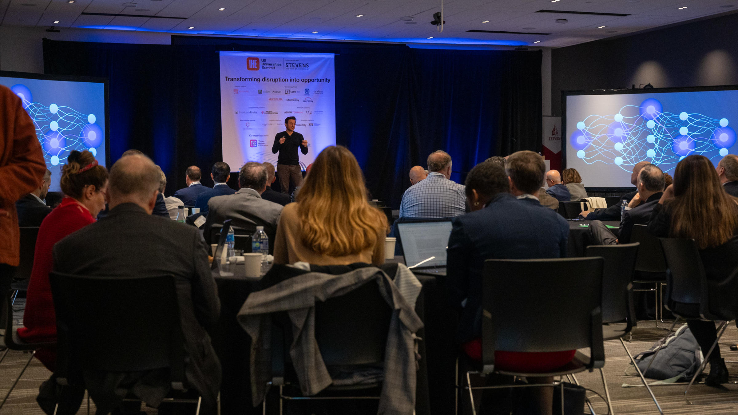 Urban in front of an audience of presidents, chancellors and provosts