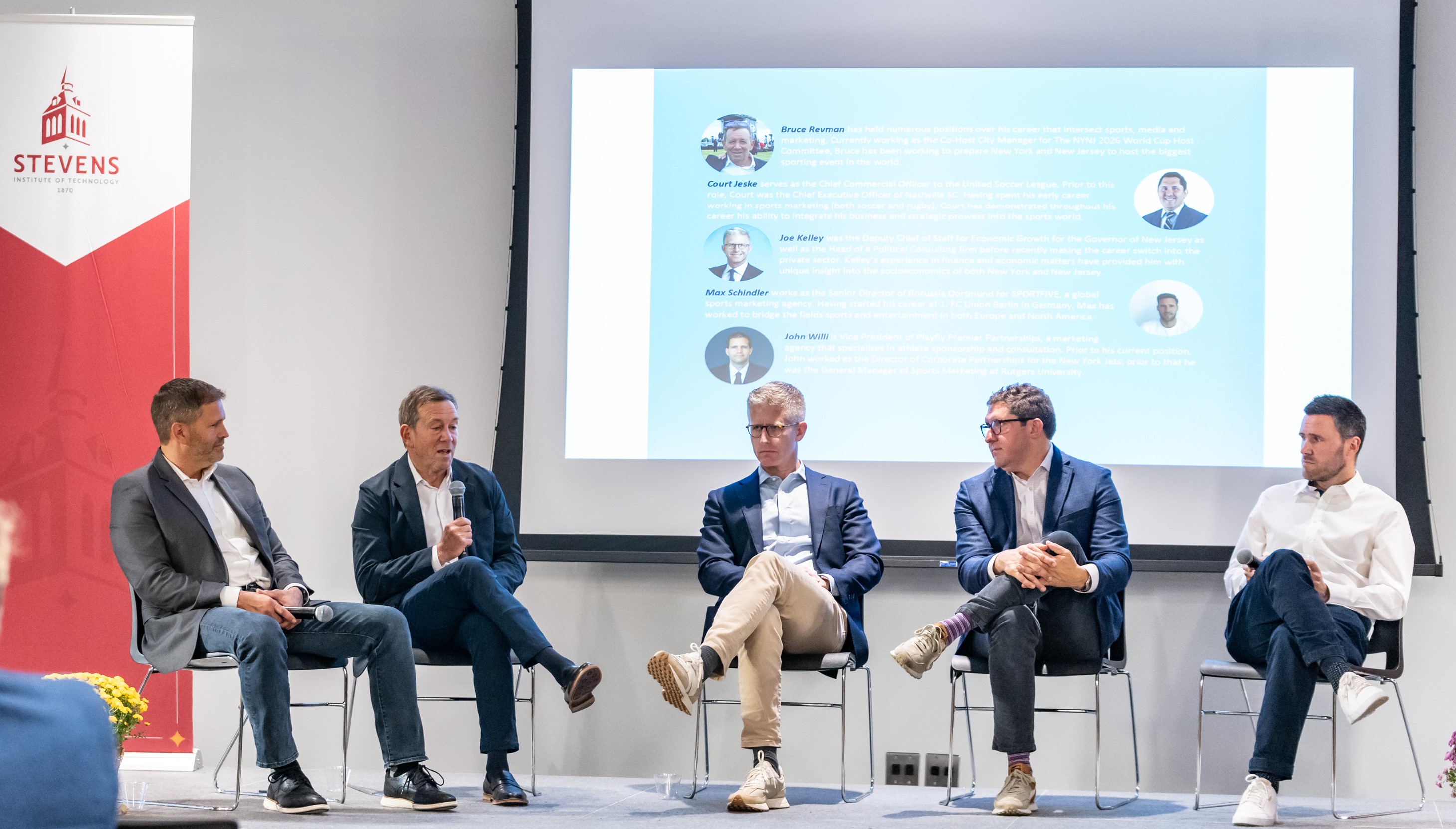 Five panelists address a crowd on the future of soccer and technology.