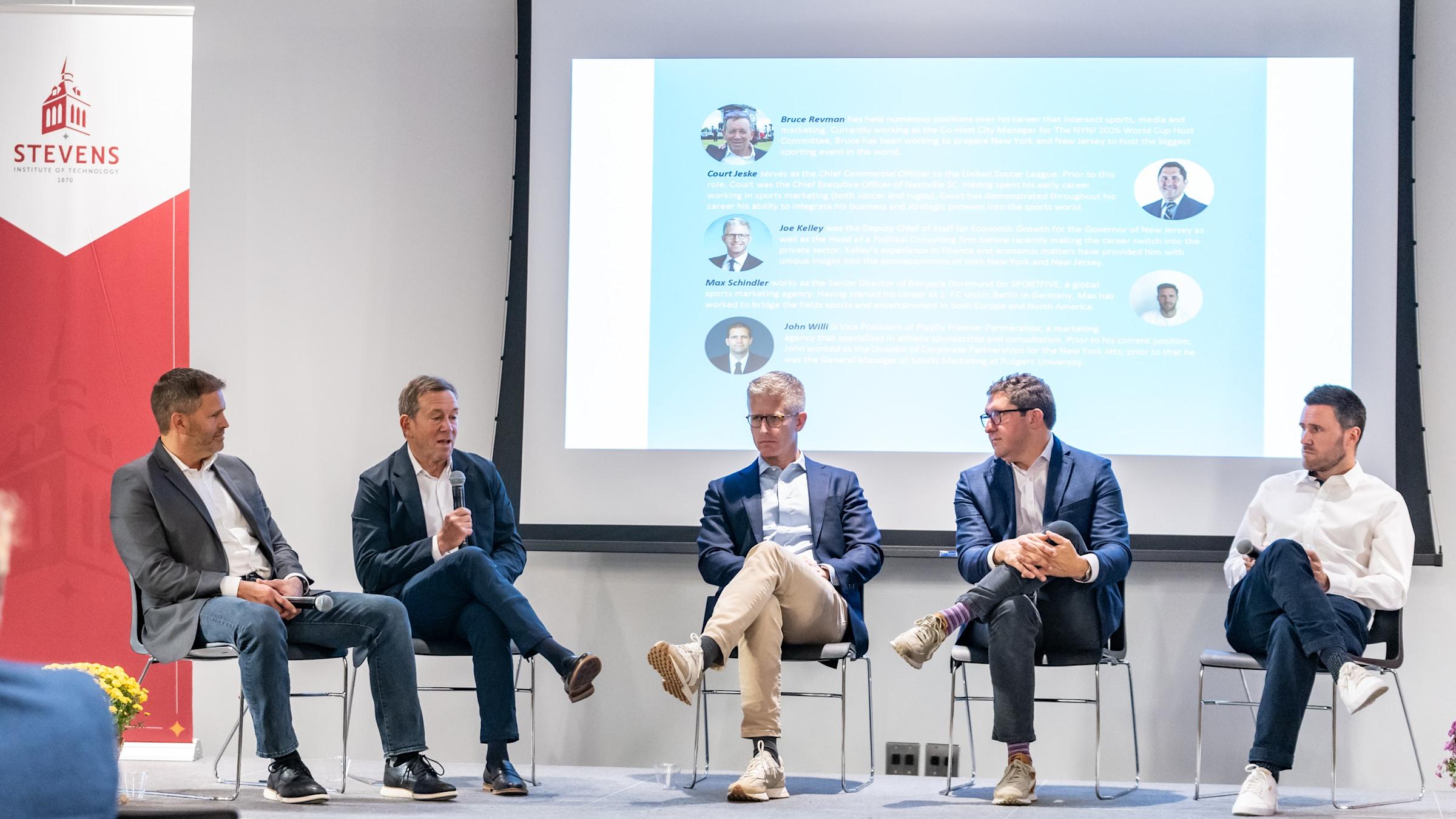 Five panelists address a crowd on the future of soccer and technology.
